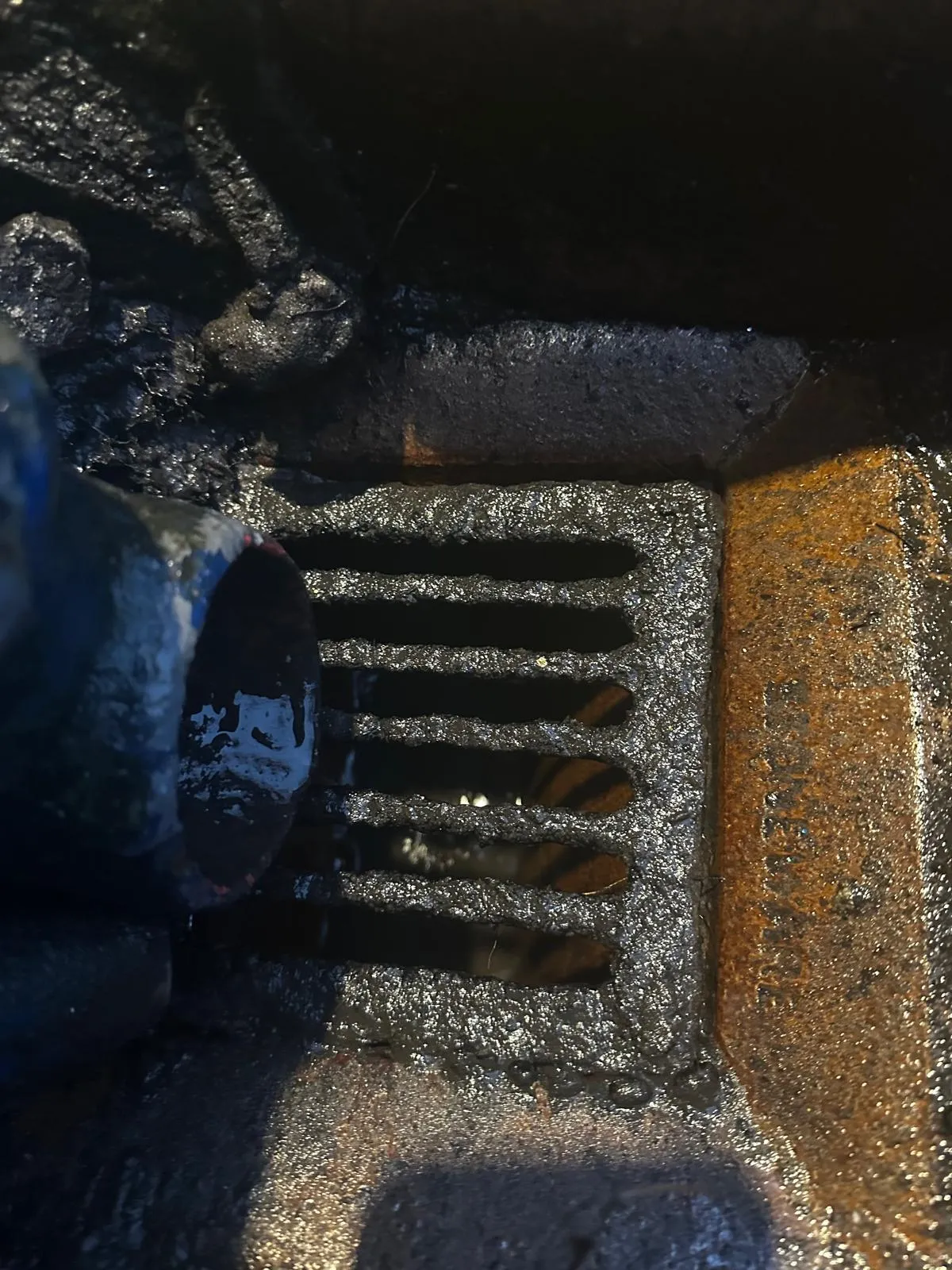 High-pressure water jetting hose clearing a blocked drain in Liverpool.