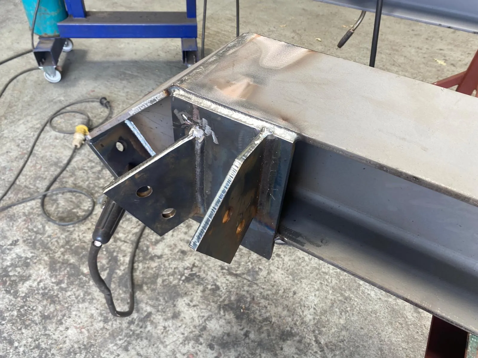 Structural steel beam with precision welded connection plates by RA Steelworks Services LTD.