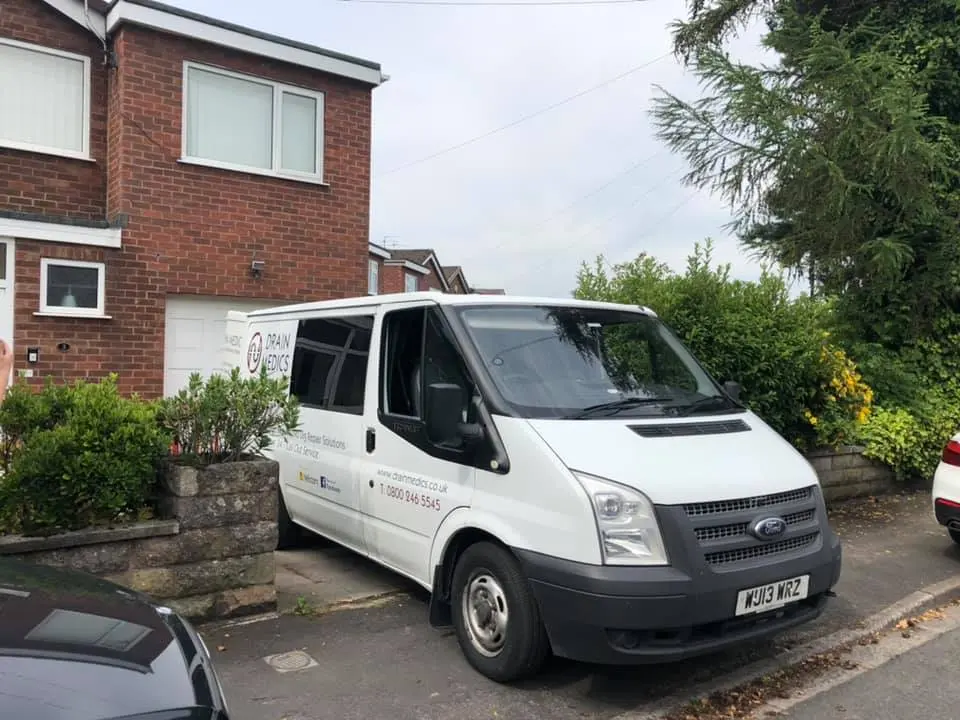 Drain Medics emergency response service van parked outside a residential property in the North West of England.