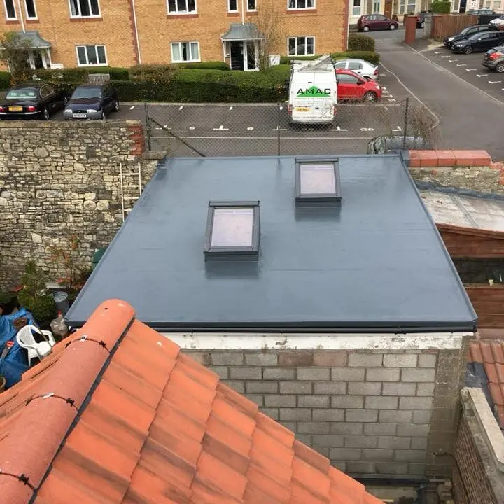 Newly installed flat roof with skylights completed by Amac Roofing