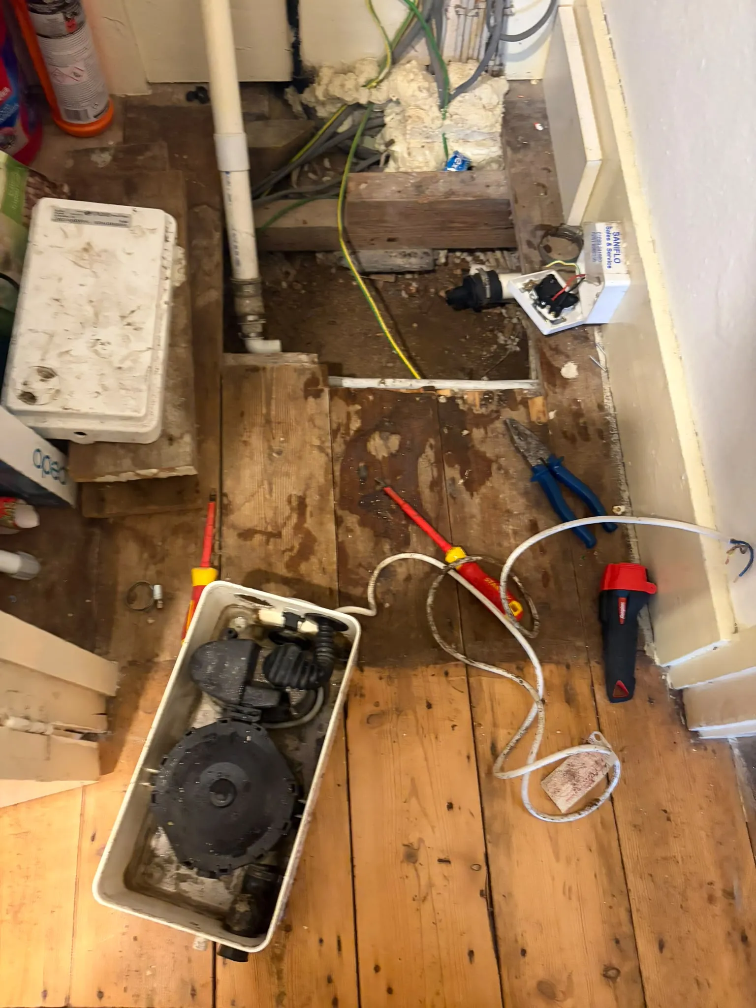 Servicing and unblocking a domestic Saniflo macerator pump unit under a bathroom floor