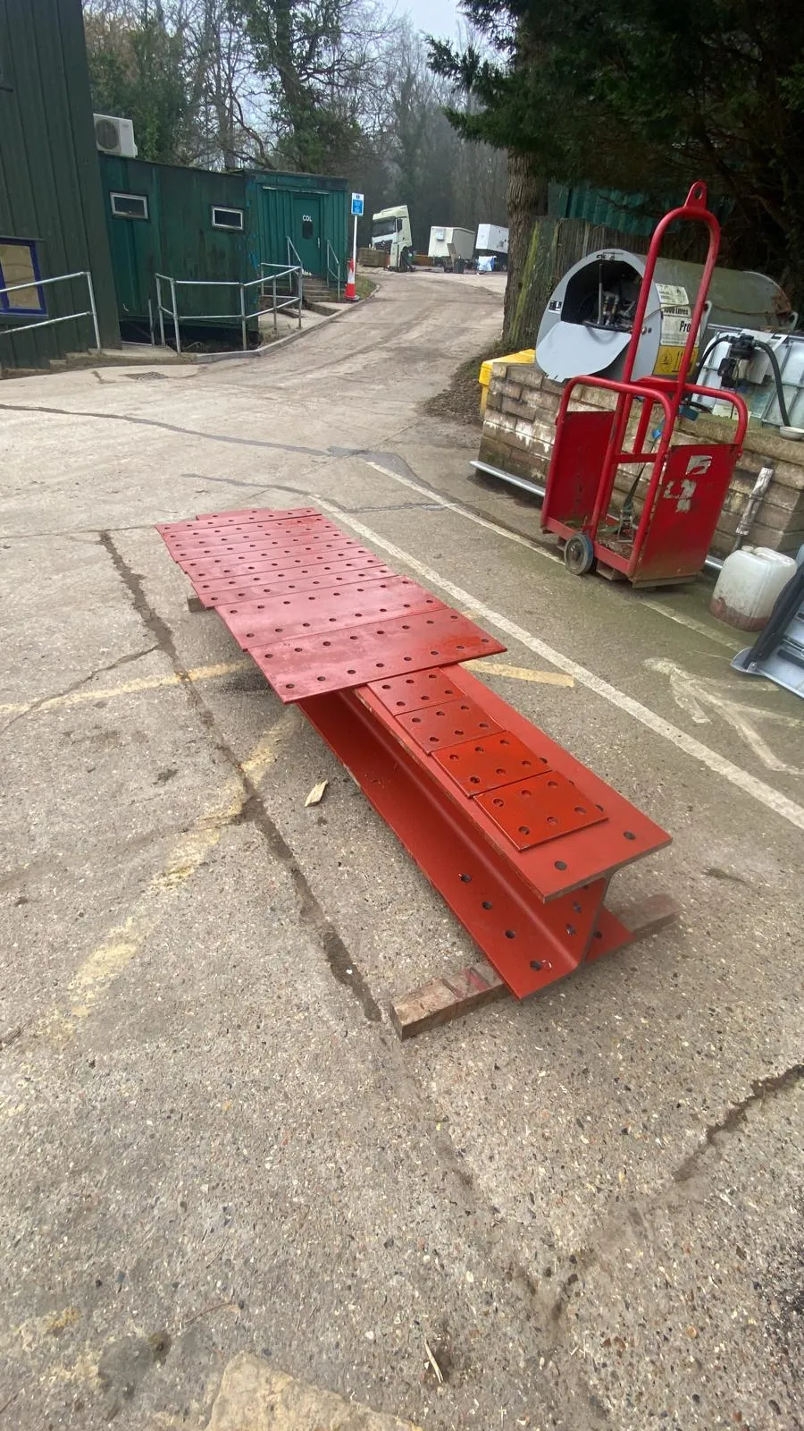 Structural steel beam and plates with red primer finish