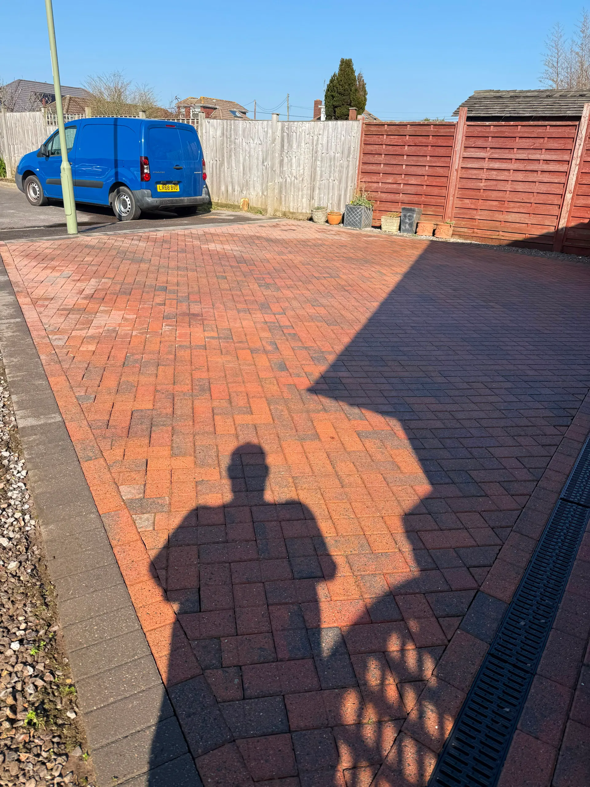 A beautifully restored block paved driveway after professional pressure washing services.