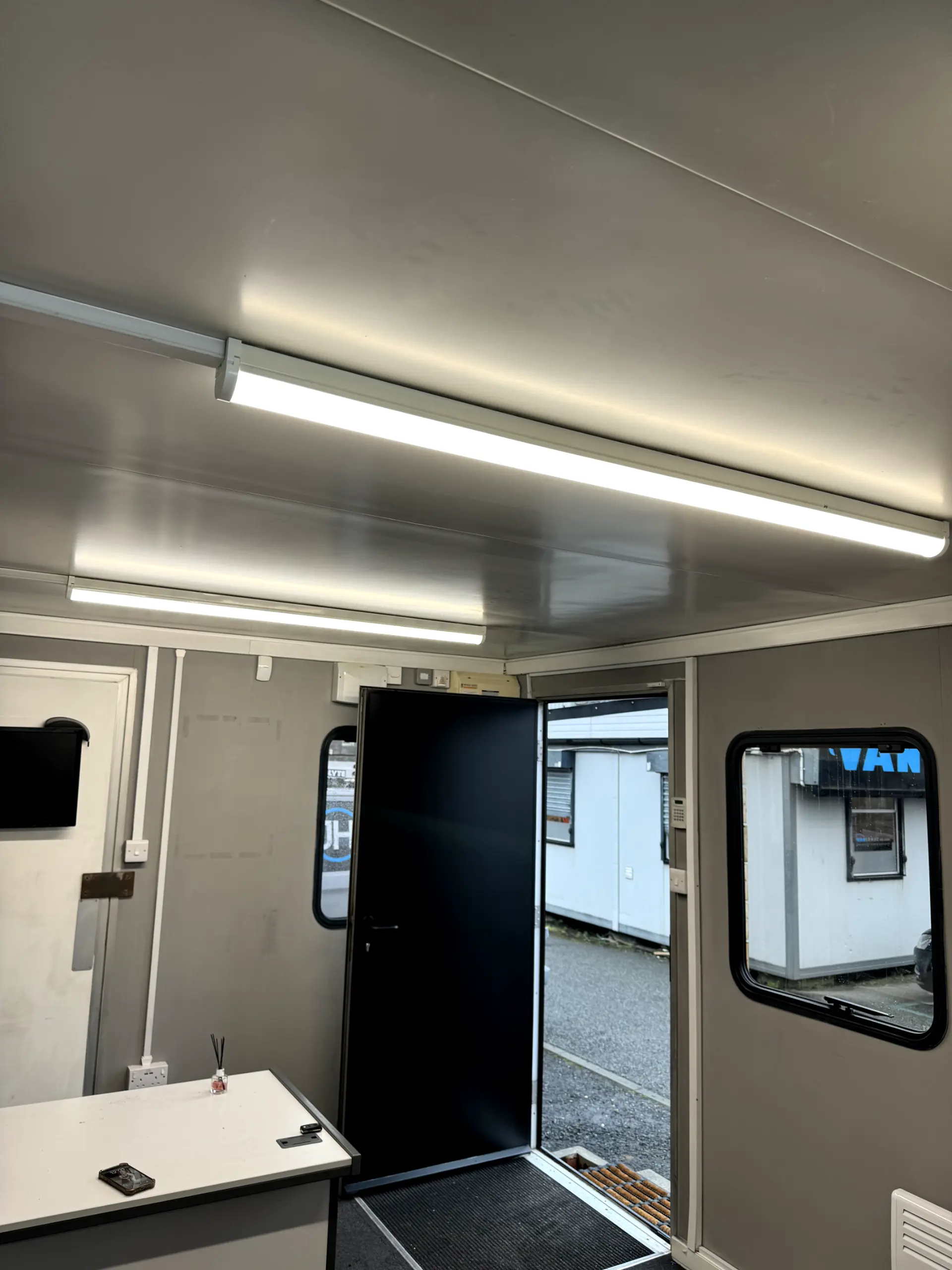 Professional electrical wiring and LED lighting installation inside a modular office space by JH Electrical Contractors Ltd.