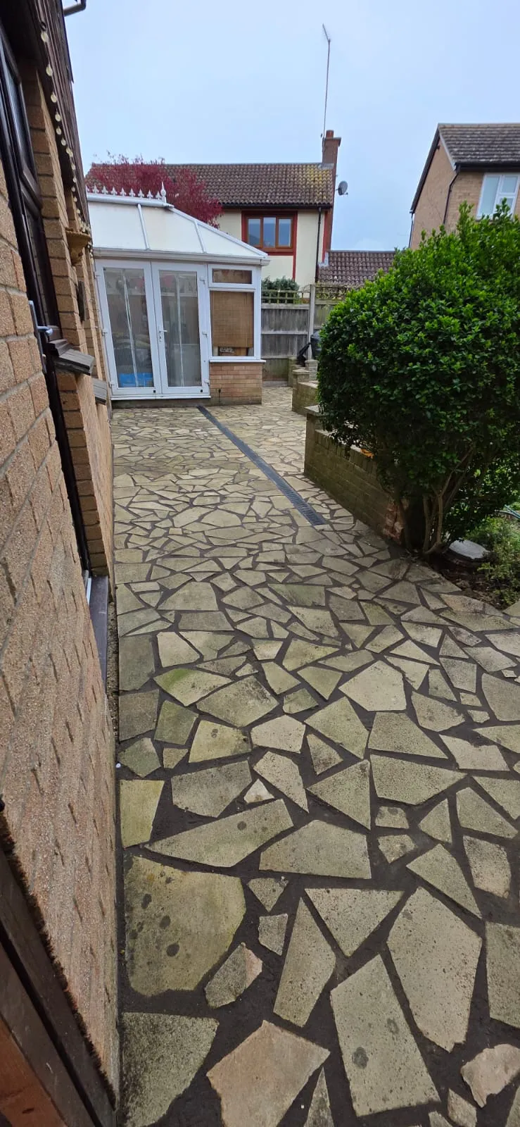 Natural stone crazy paving patio installation by FLEX PROPERTY SERVICES in Felixstowe