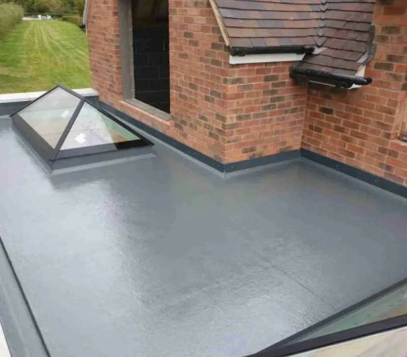 Newly installed grey flat roof with a pyramid roof lantern and brickwork, showcasing modern flat roofing and rooflight installation by P D Roofing & Building Contractors.