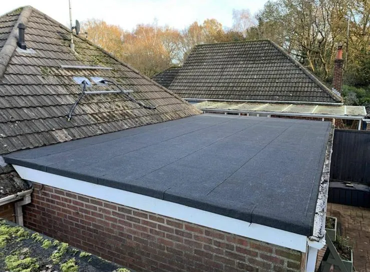 Newly installed torch-on felt flat roof on a residential extension