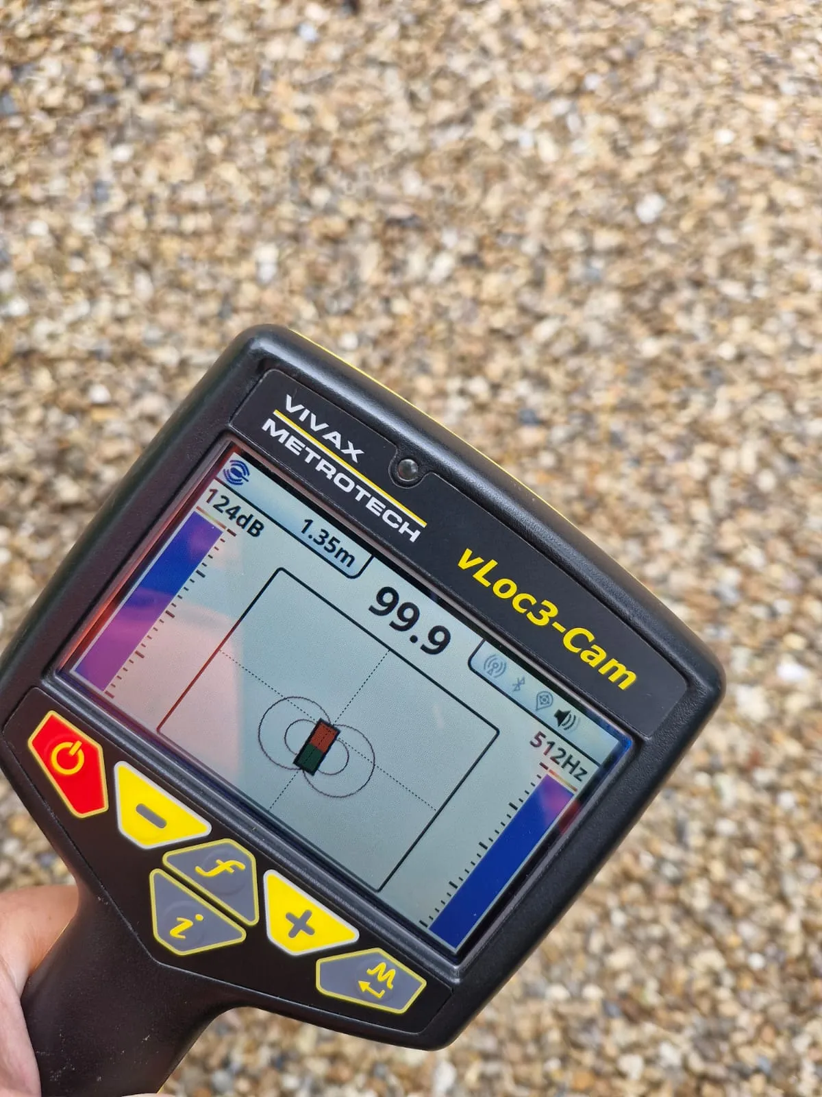A professional drain locating and mapping device being used to identify the depth and position of underground pipes by Roberts Drainage Ltd.