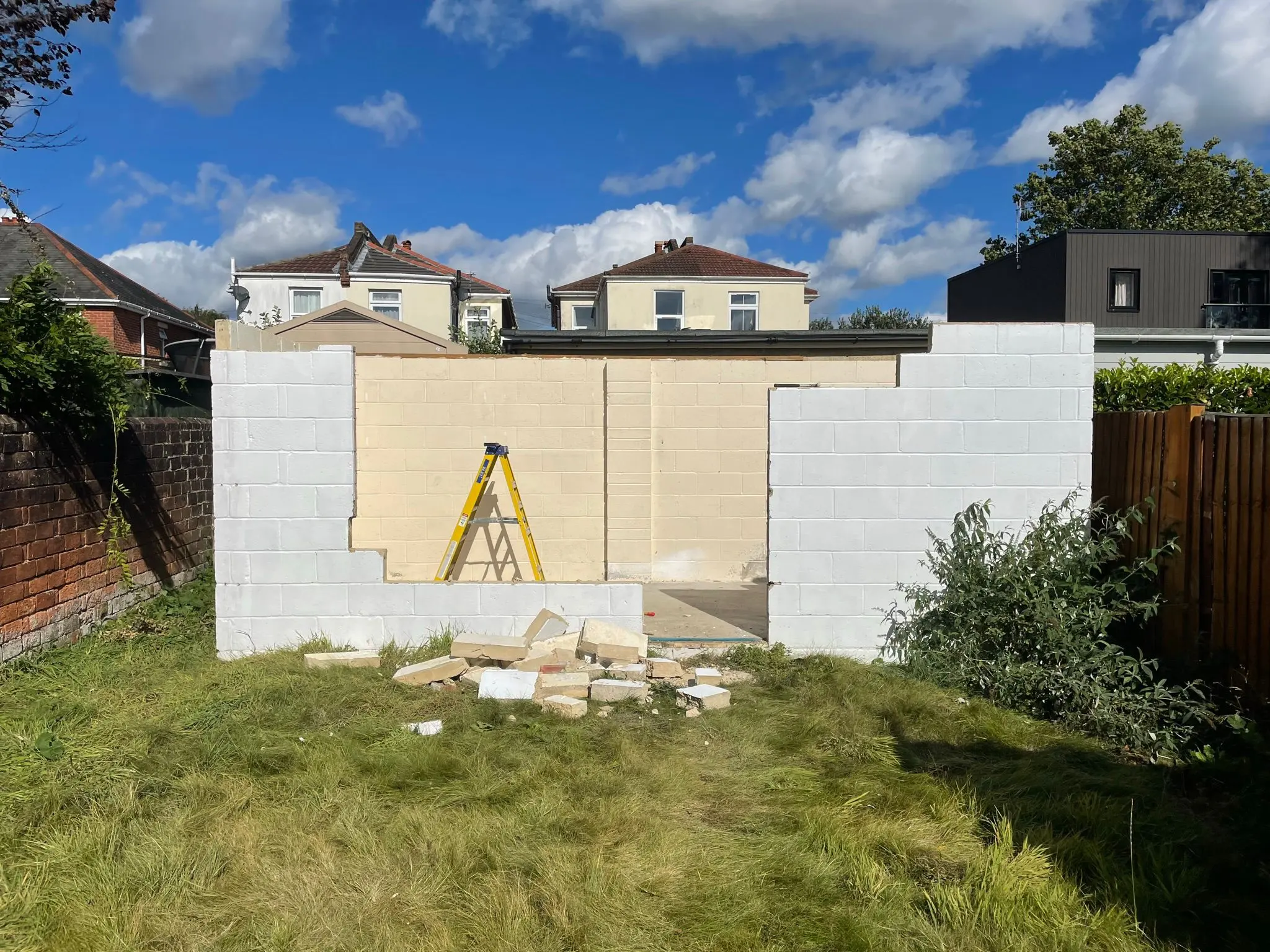 A picture of partially built white breeze block walls for a single-storey extension or garden room project