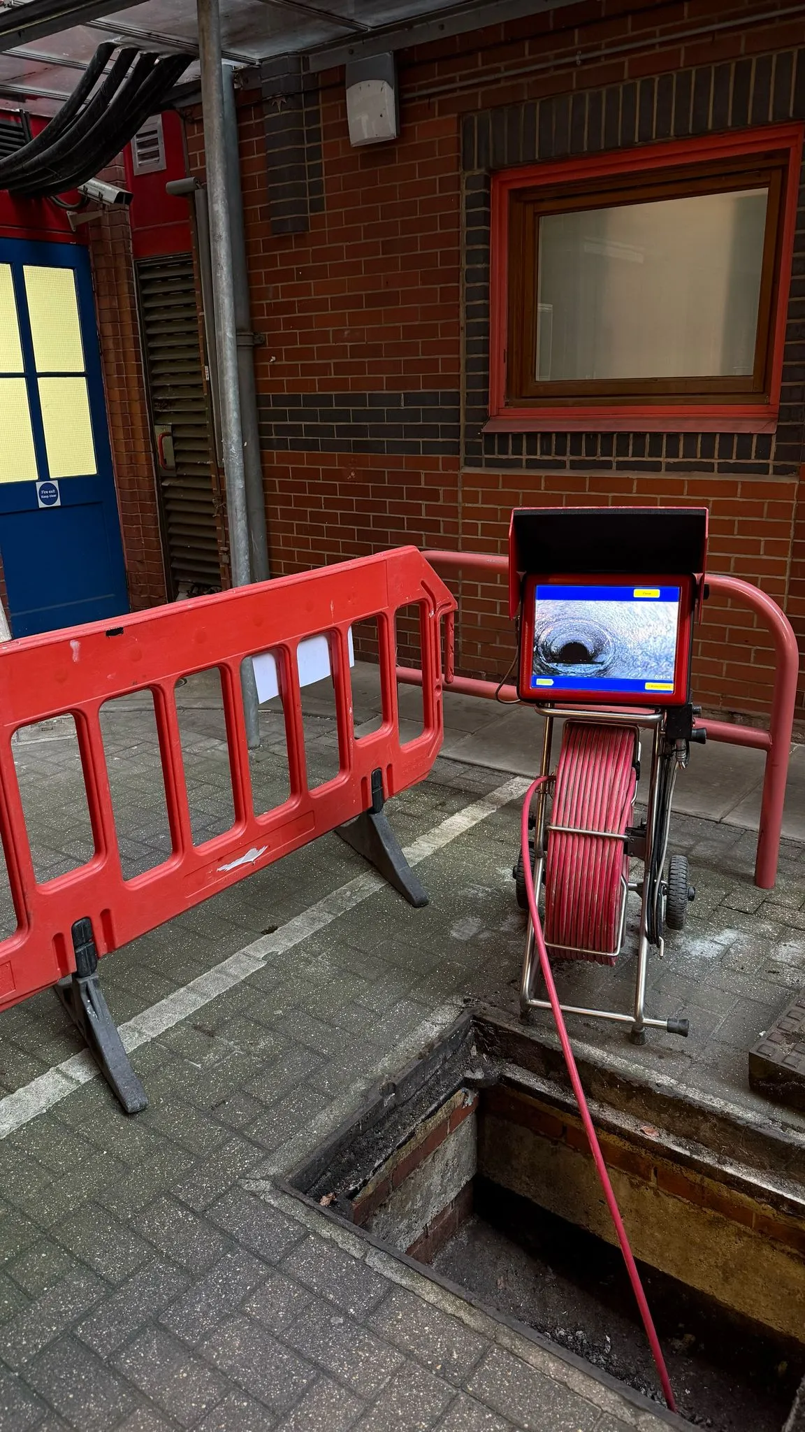 Professional CCTV drain survey equipment in operation at a commercial site