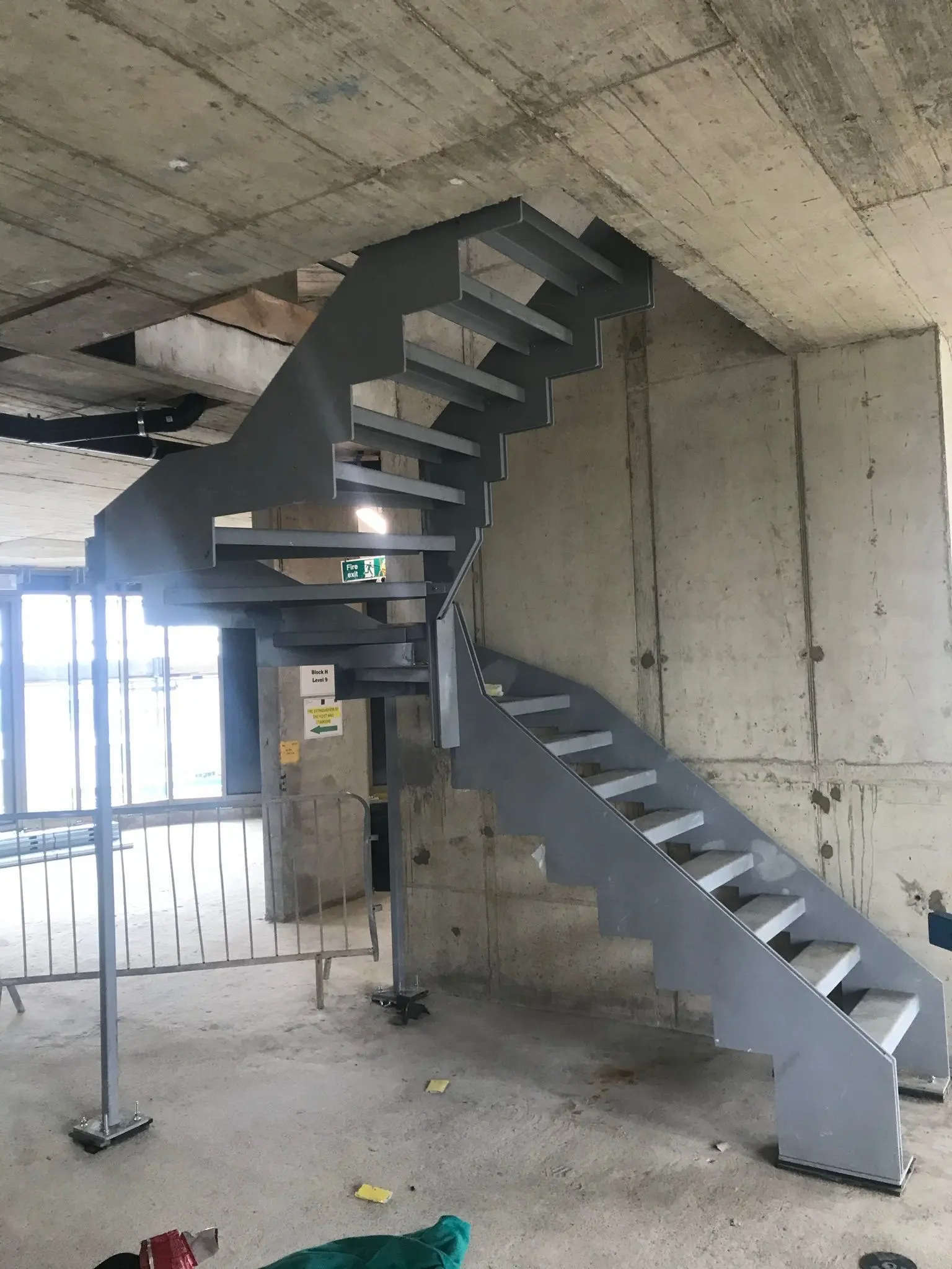 Structural steel staircase erected inside a new commercial industrial unit by steel building contractors