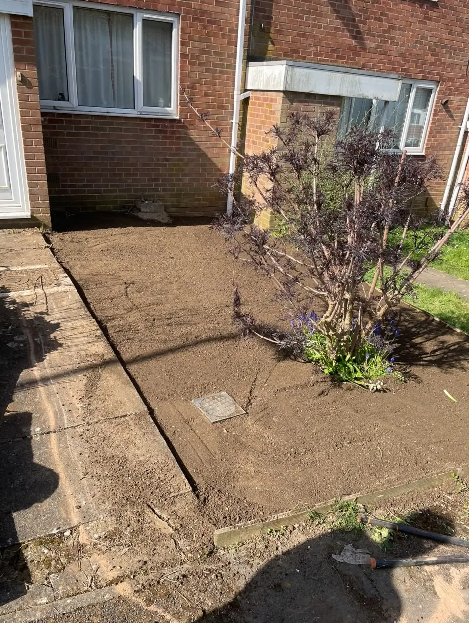 Ground preparation and levelling work completed in a residential front garden