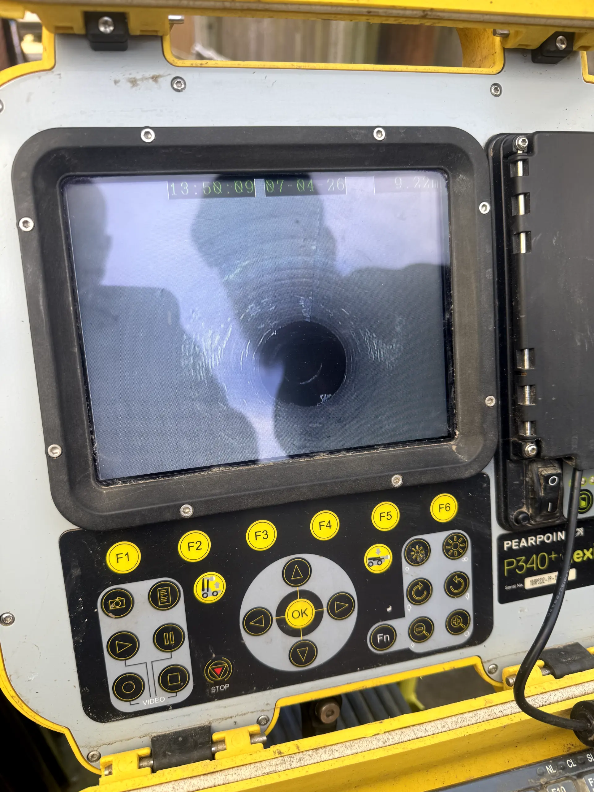 A CCTV drain survey monitor showing a live pipe inspection for a client in Darwen.