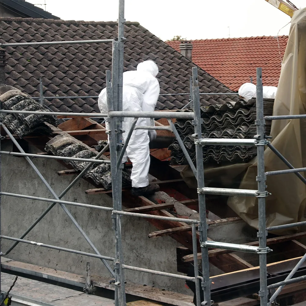 Stay Safe Environmental team performing safe asbestos roof removal on a residential property.