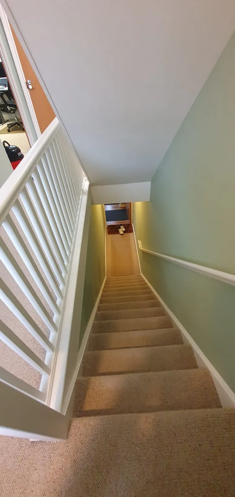 Professional interior painting and decorating of a residential staircase by FLEX PROPERTY SERVICES in Felixstowe.