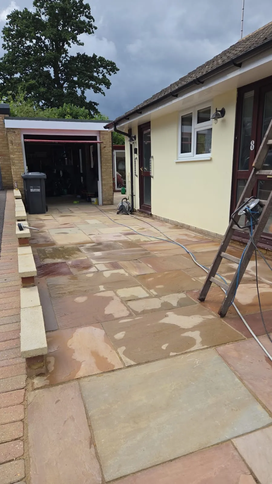 Professional Indian sandstone patio cleaning and restoration by Prestige Home Improvements in South-East London.