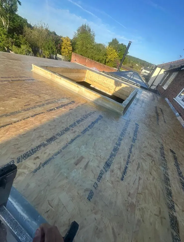 OSB3 decking and timber roof lantern upstand prepared for flat roofing installation in Plymouth