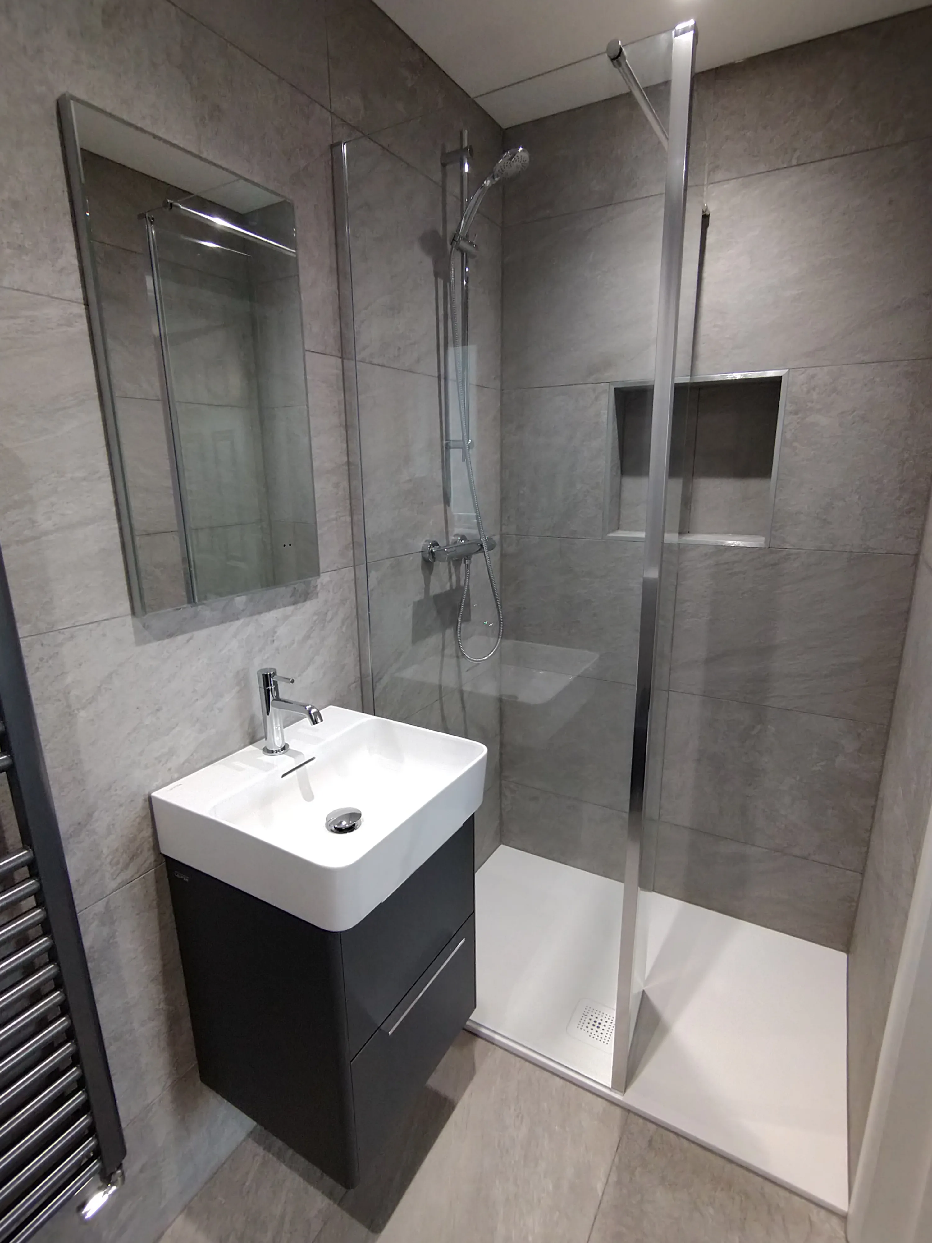 Bespoke luxury walk-in shower and modern vanity unit installation in a Plymouth home by Sands & Vossen.