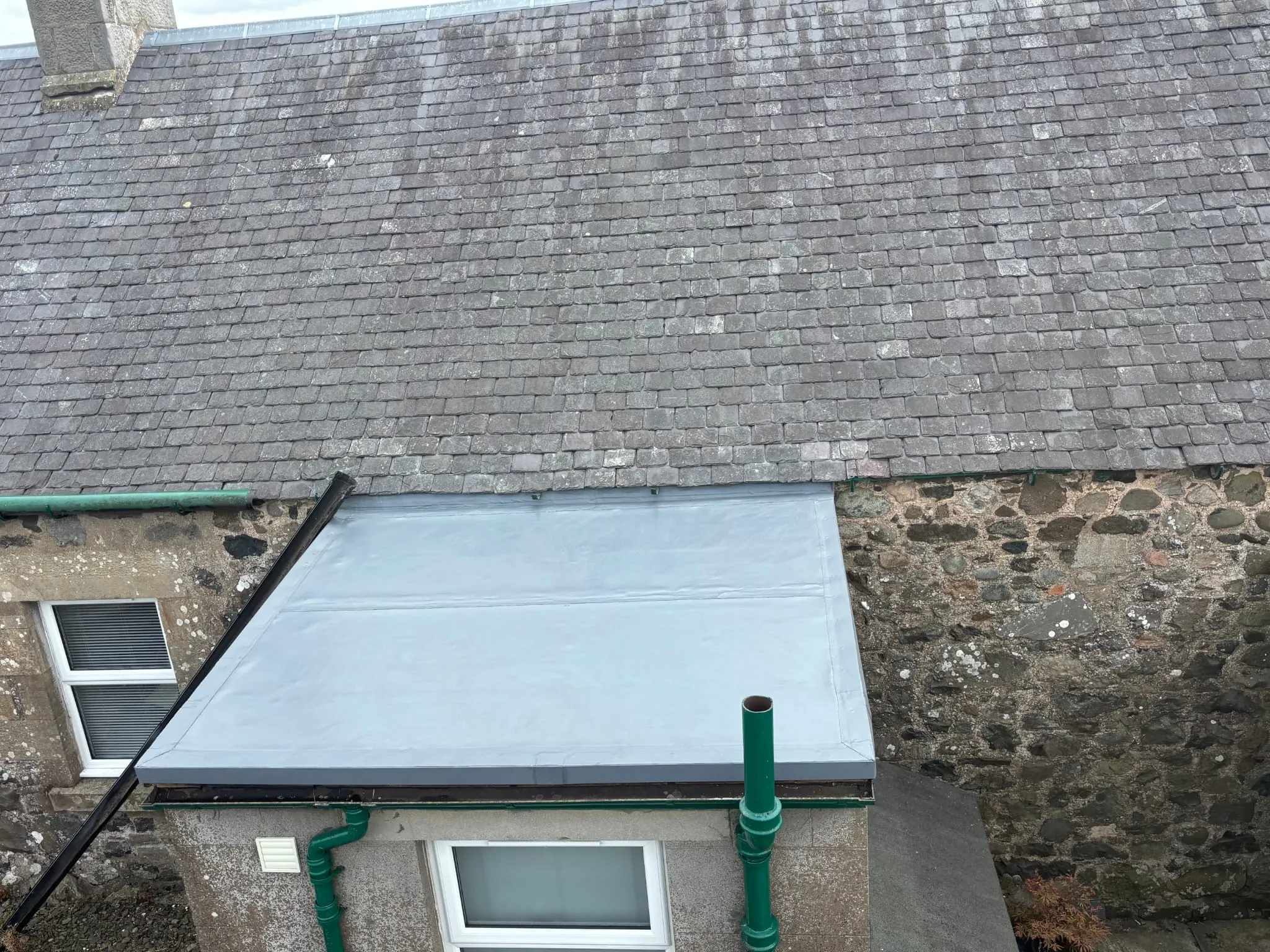 Fatra single ply flat roof installation on a property extension adjoining a slate roof in Fife