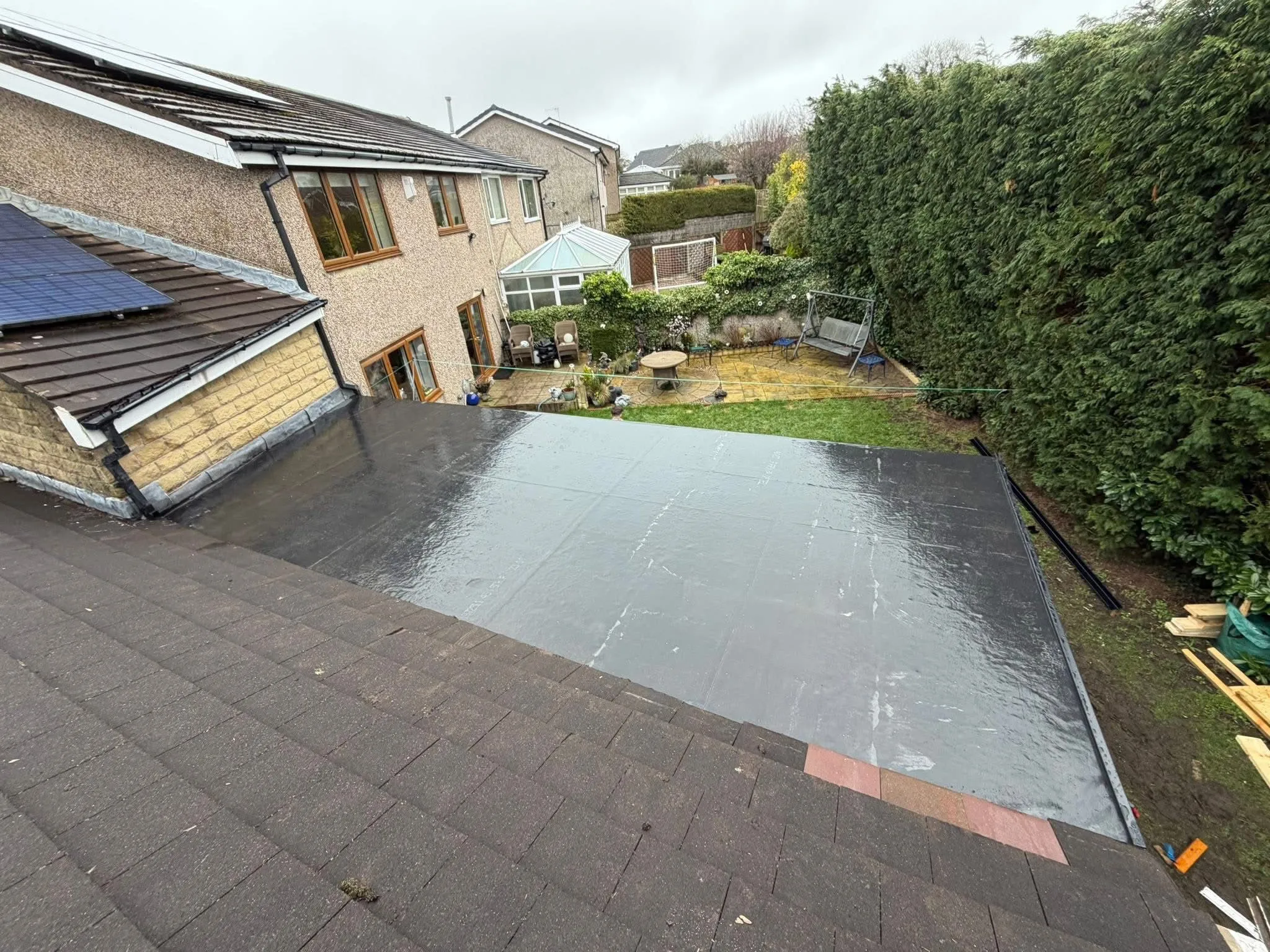Expert EPDM rubber flat roof installation on a house extension by Lancashire Roofing Specialist in Blackburn.