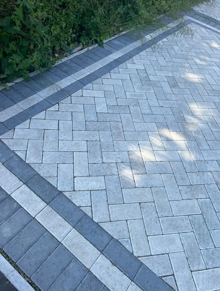 High-quality block paving driveway with herringbone pattern and decorative border