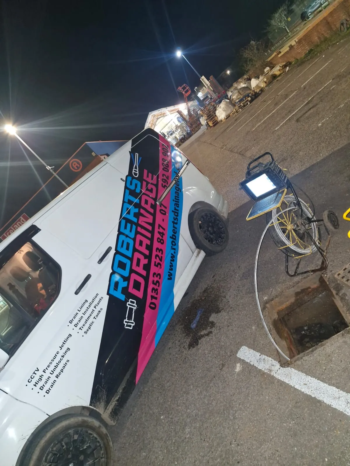 Roberts Drainage Ltd van and CCTV drain survey equipment being used at night