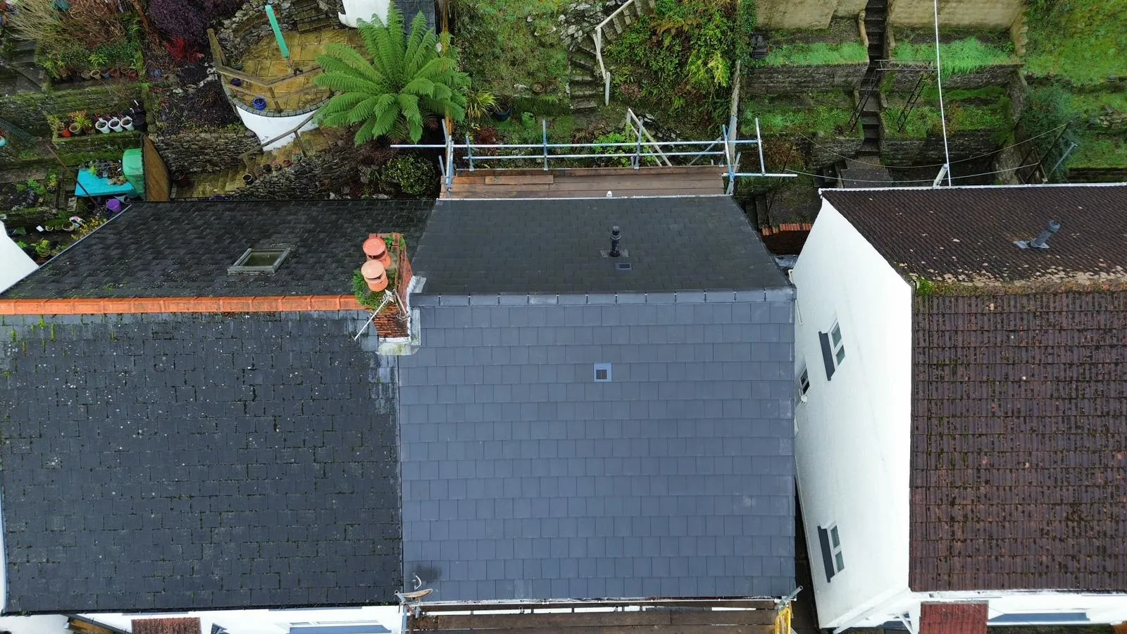 Aerial view of a professional slate roof replacement in Gloucestershire