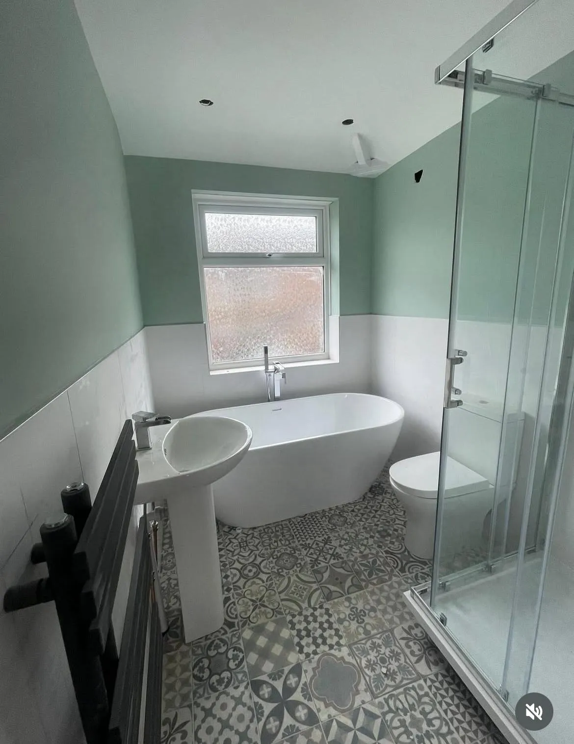 Complete modern bathroom installation in York including a freestanding bath and walk-in shower.