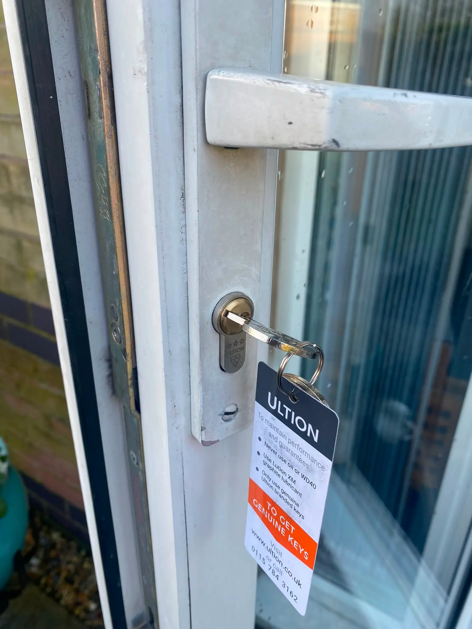High-security Ultion anti-snap Euro cylinder lock installed on a uPVC door.