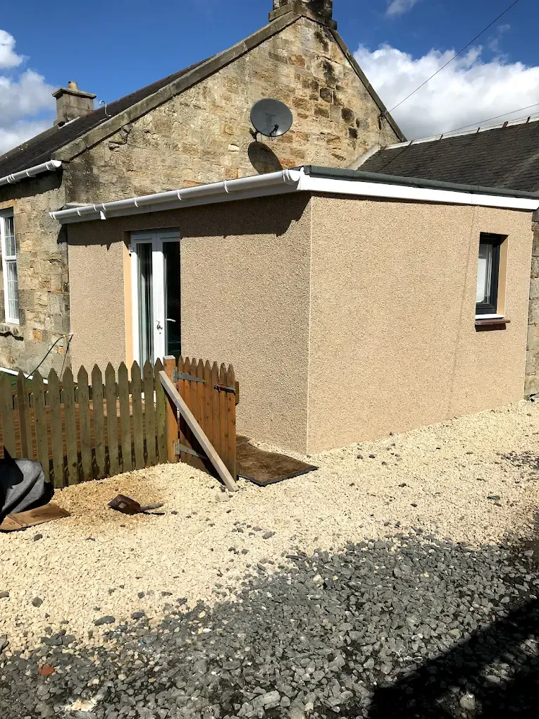 A newly roughcasted residential extension in South Lanarkshire by Gordon Gardiner Slater & Plasterer.
