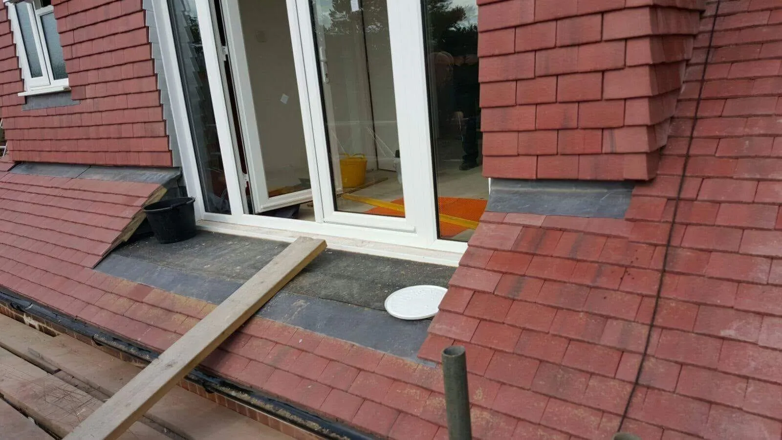 Expert tile roofing installation and leadwork by Firmus Roofing & Building on a Buckinghamshire home extension.