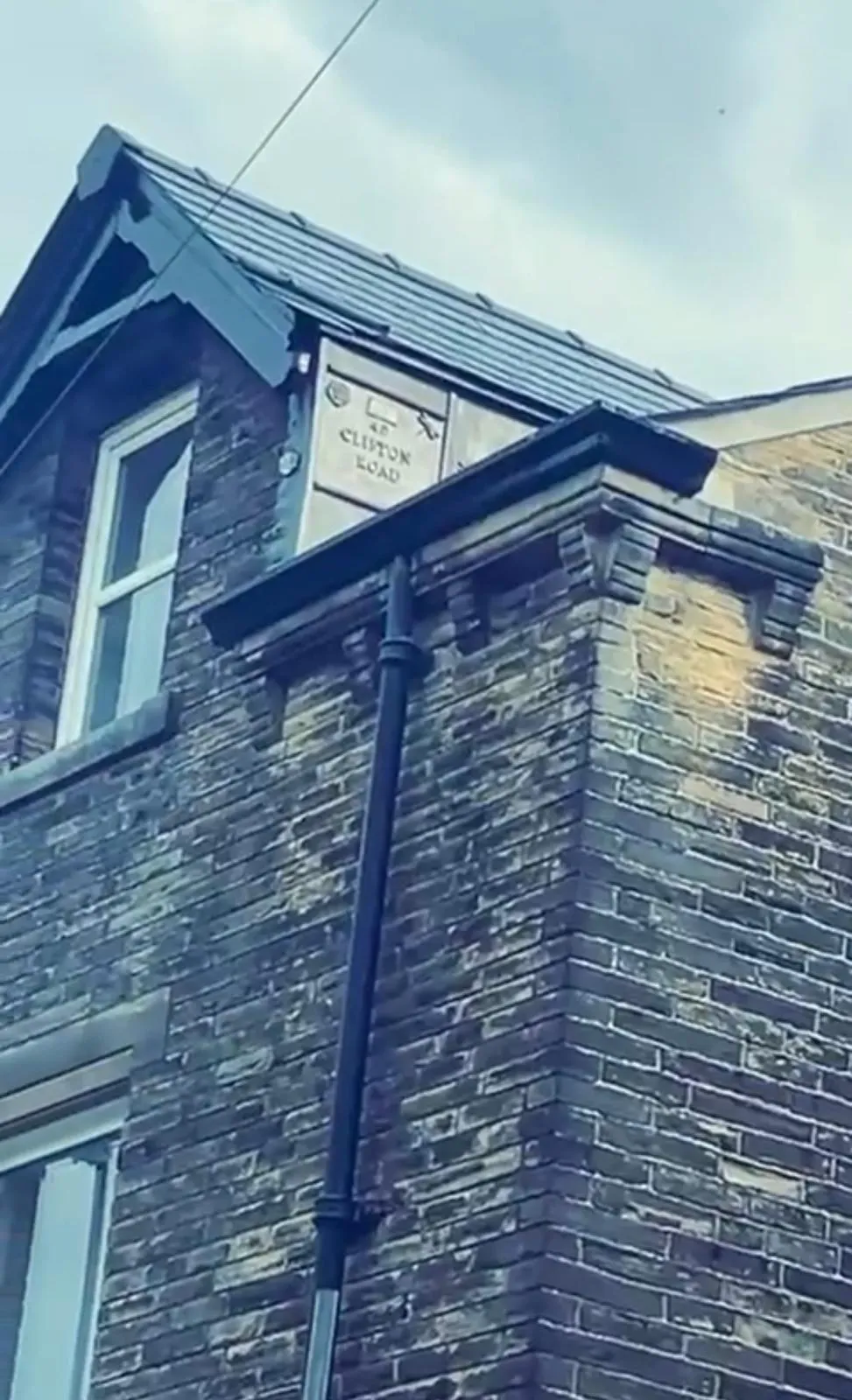 Slate roofing and guttering on a heritage-style house in Holmfirth, West Yorkshire.