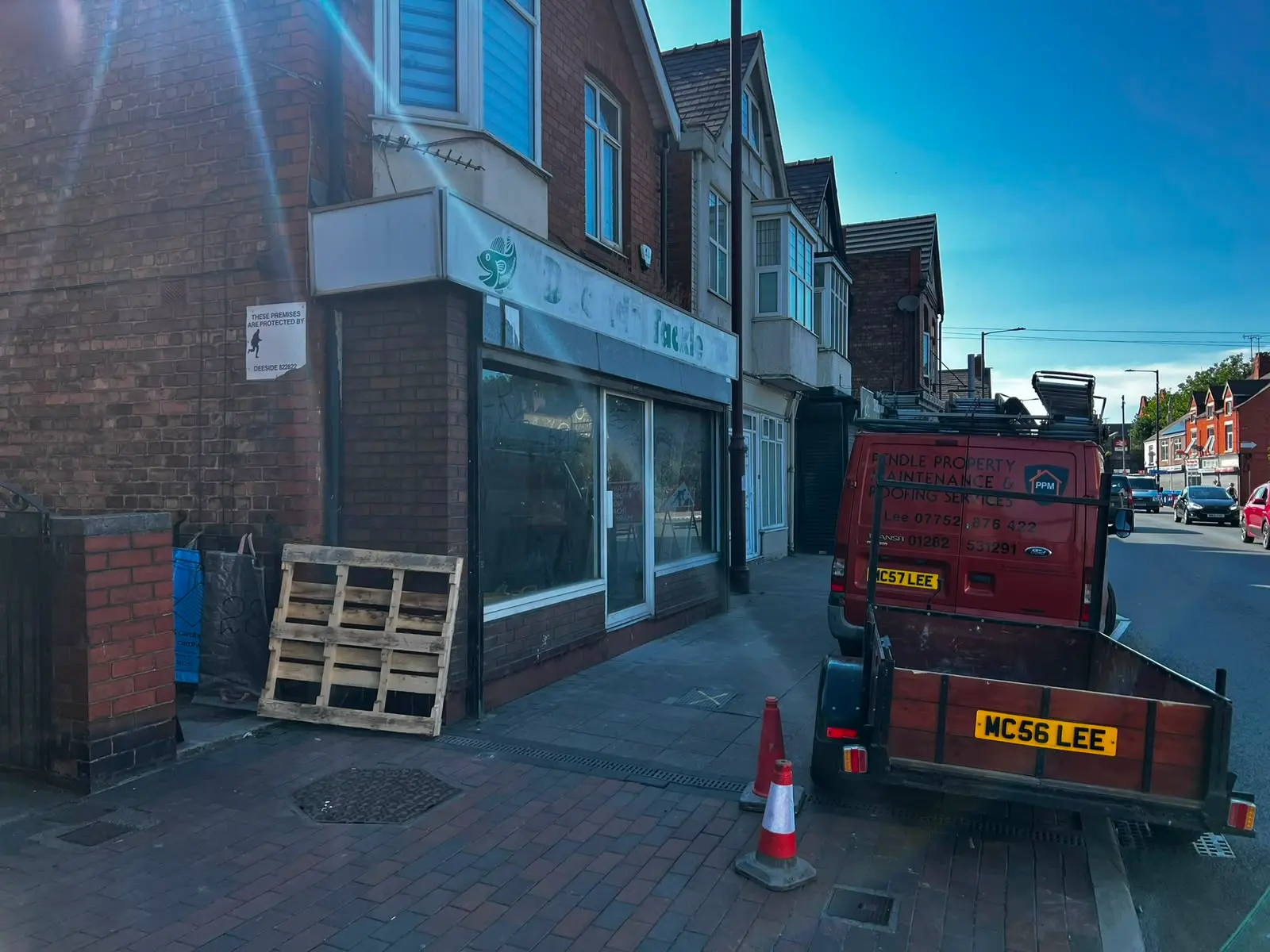 A picture of Pendle Property Maintenance and Roofing Services van parked outside a commercial property in Burnley