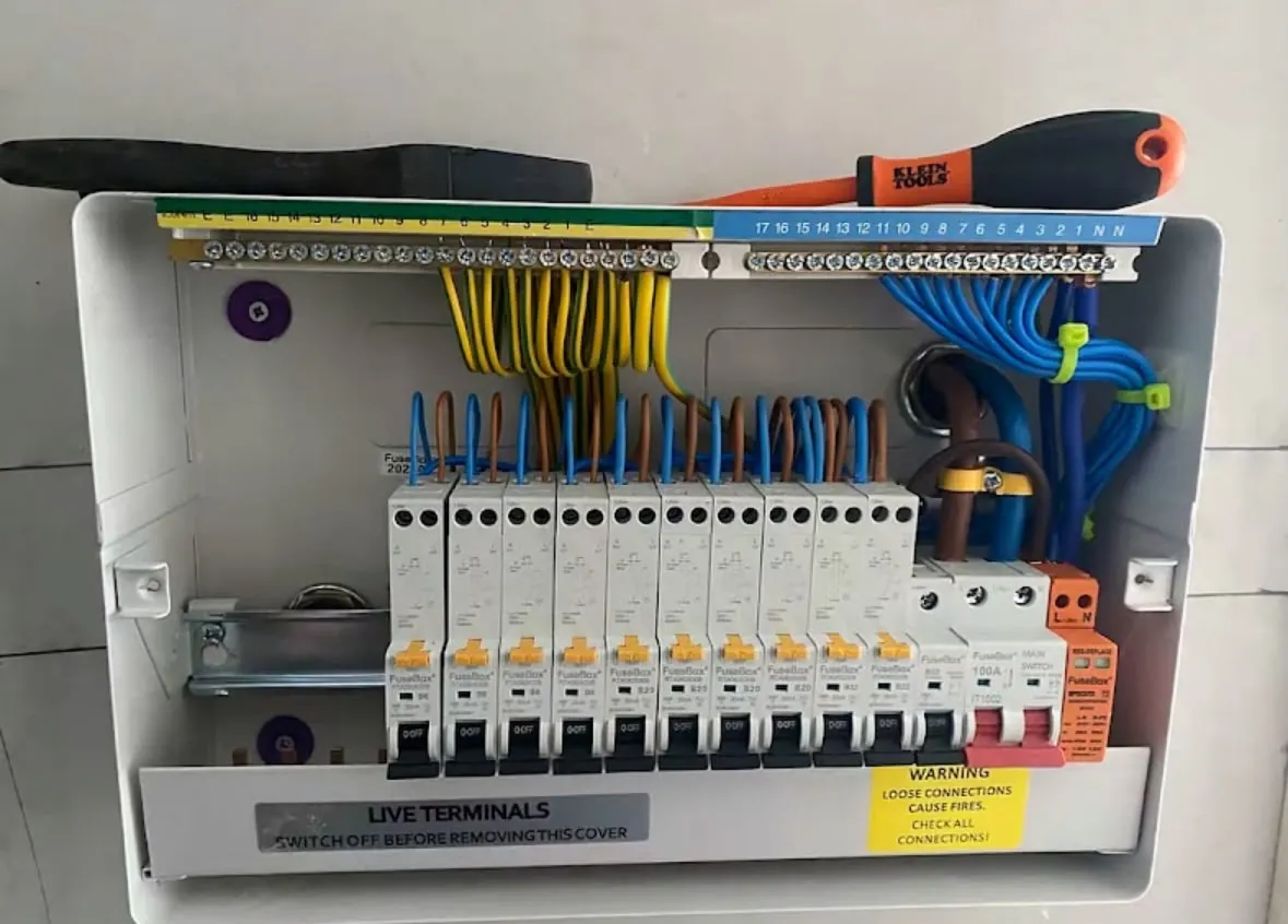 Modern metal-clad consumer unit replacement with RCBOs and surge protection