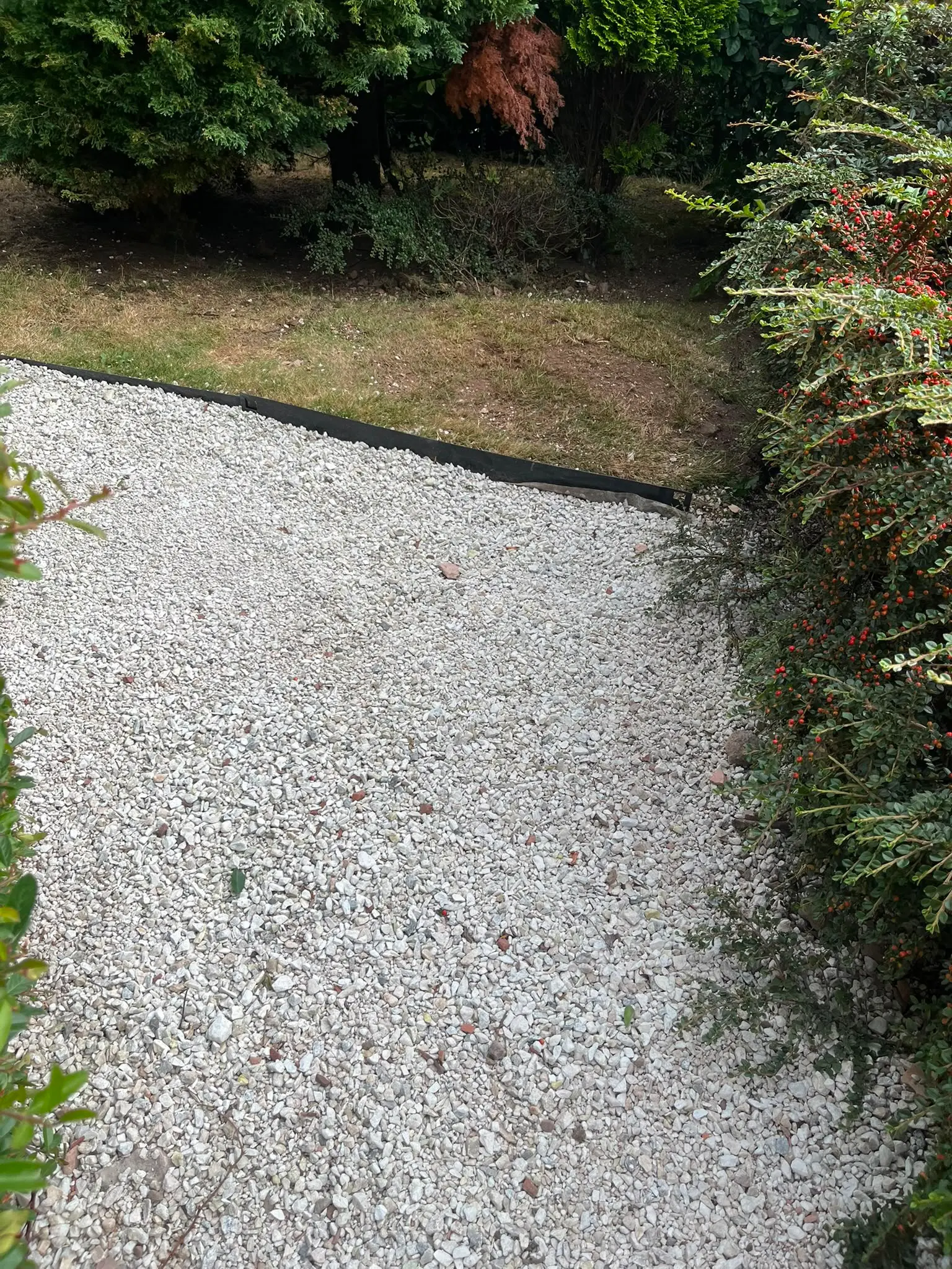Completed groundworks and soakaway installation with a clean gravel finish by CB Drainage