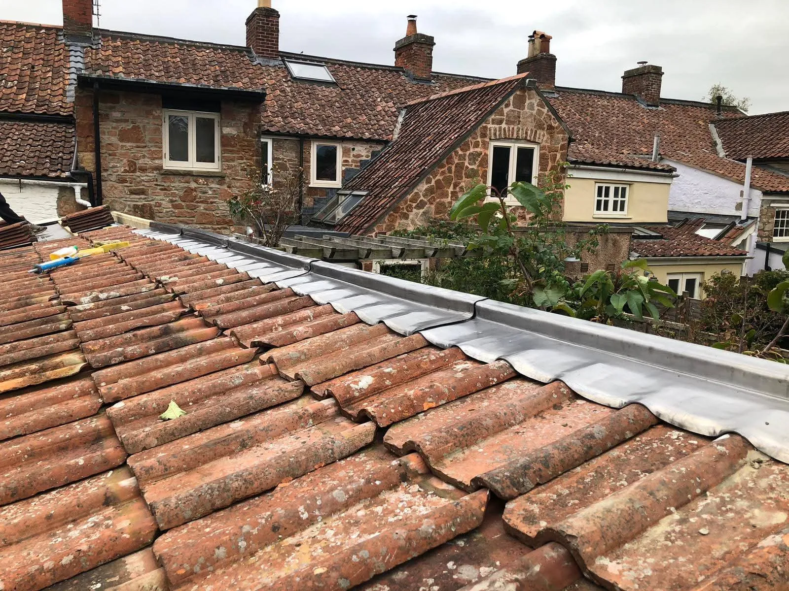 Expert leadwork and roof flashing repair on a heritage property by NTL Roofing specialists.