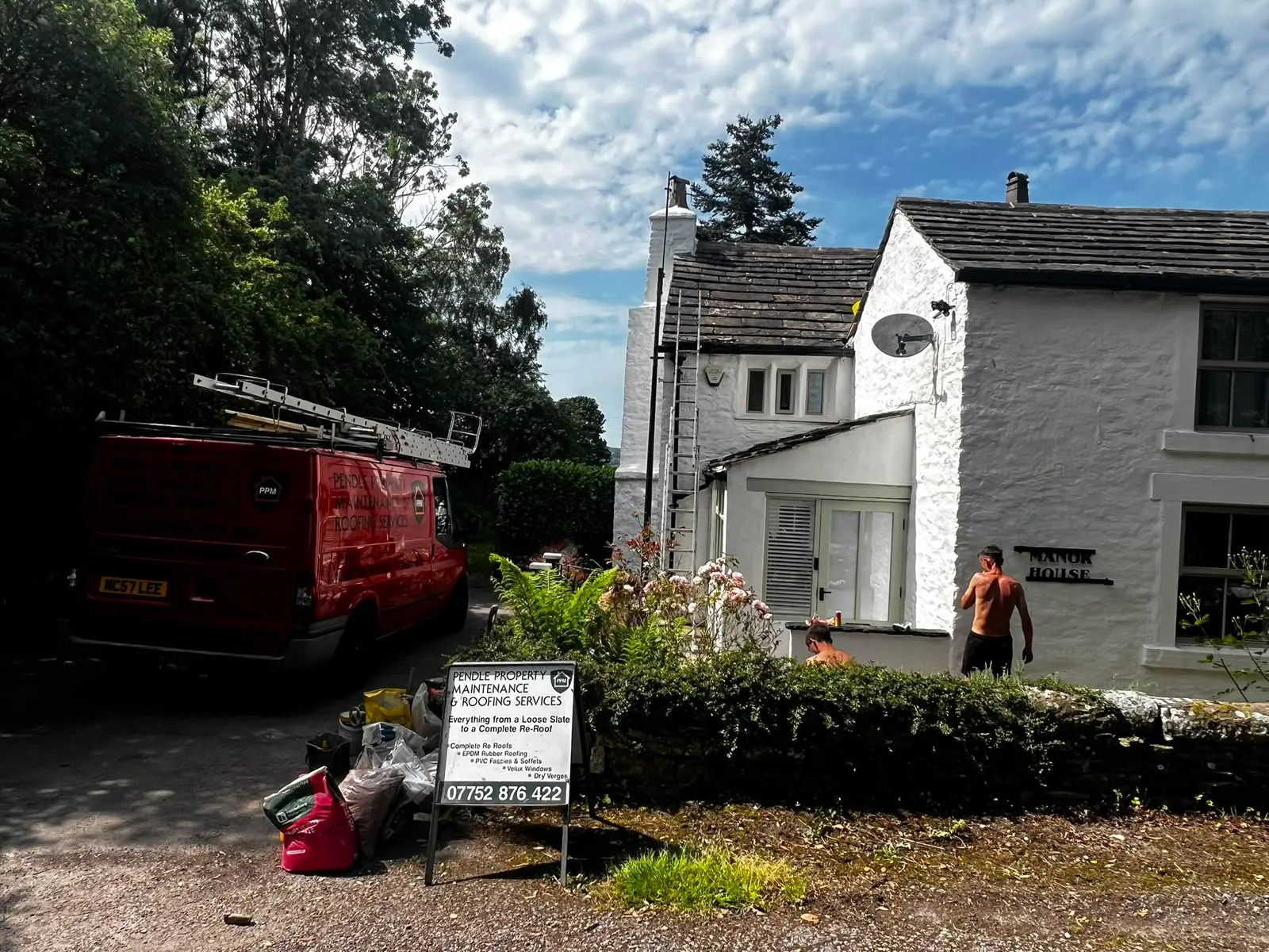 Pendle Property Maintenance van and workers at a roofing job site in Burnley
