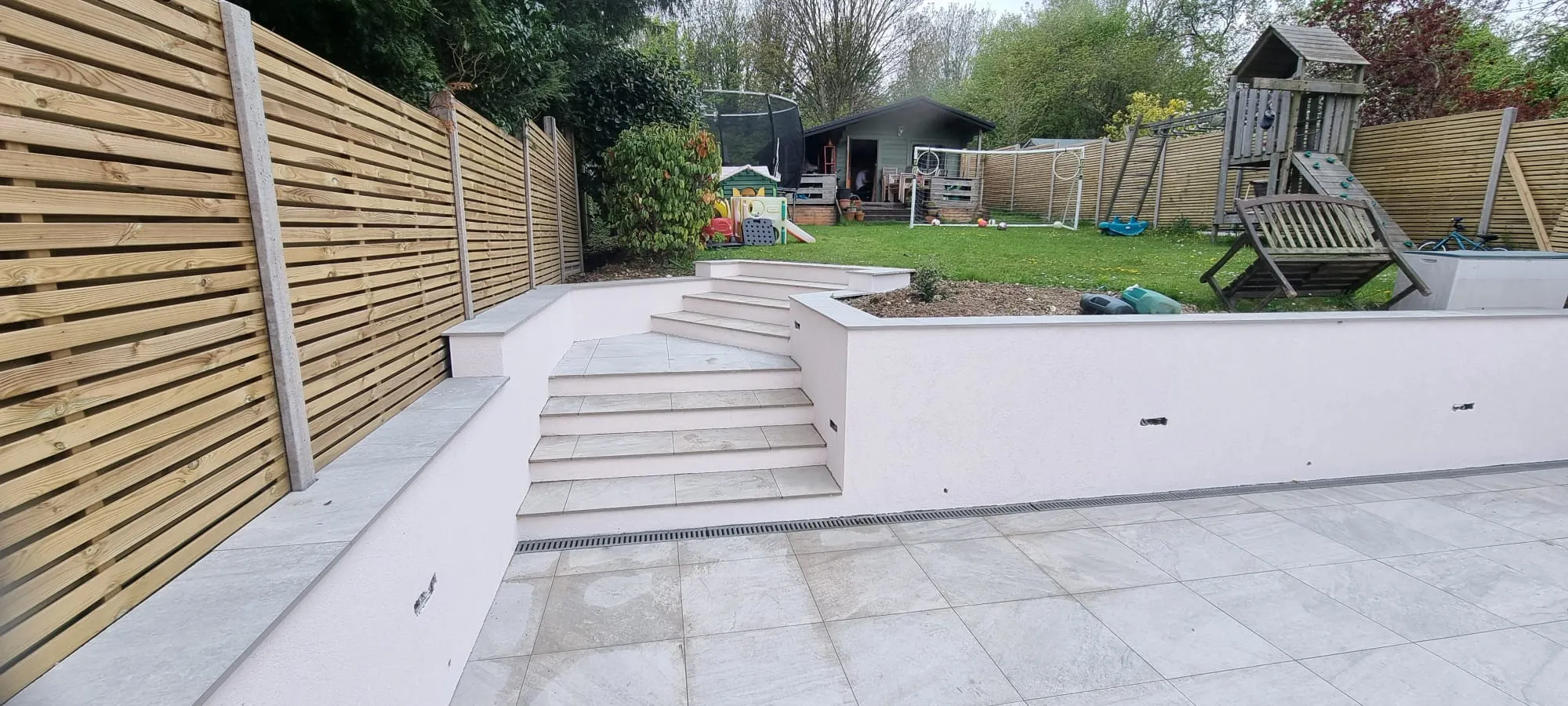 High-quality external rendering on a garden retaining wall and steps in Southwick, completed by Portslade Plastering.