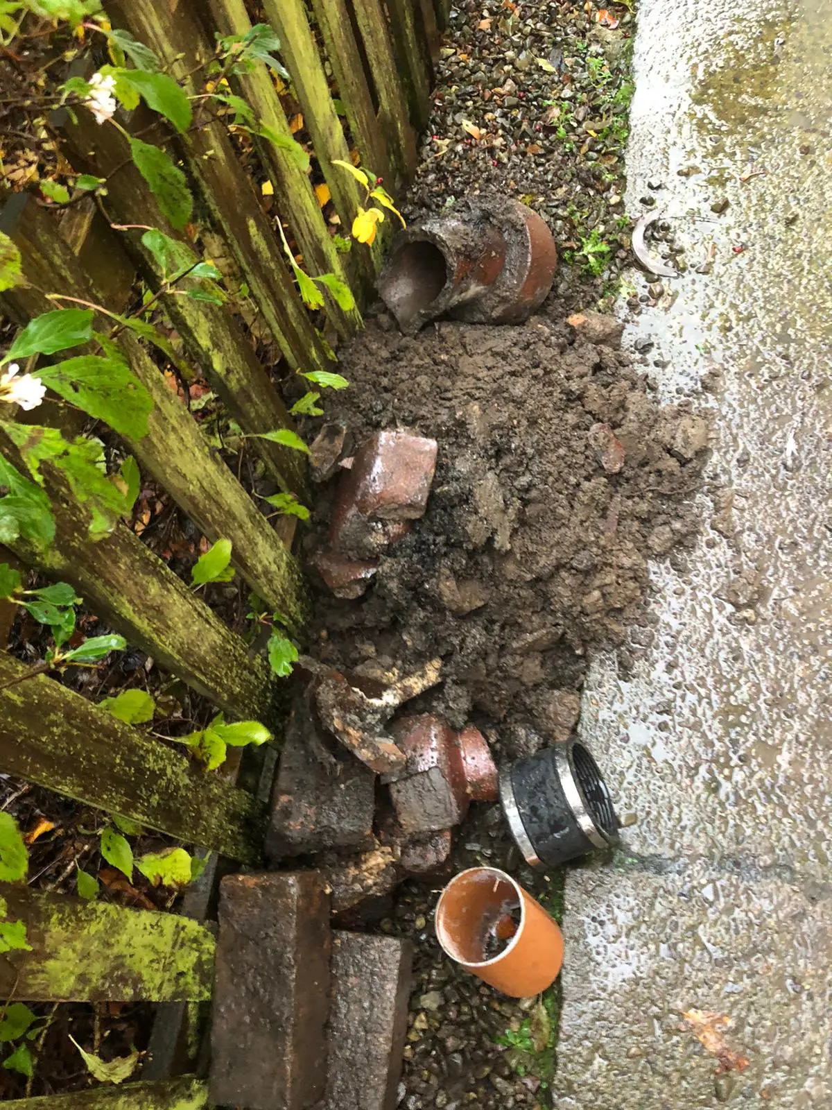 Excavated broken clay drainage pipes and soil from a collapsed drain repair job by CB Drainage