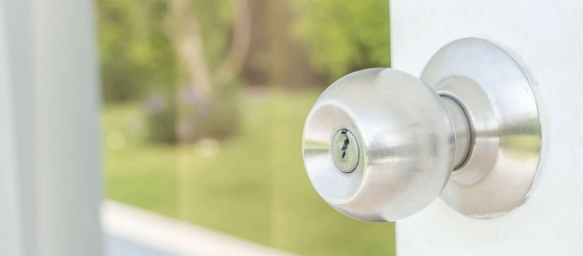 A high-quality silver door knob and lock installed on a residential door by Fortify Locksmiths.