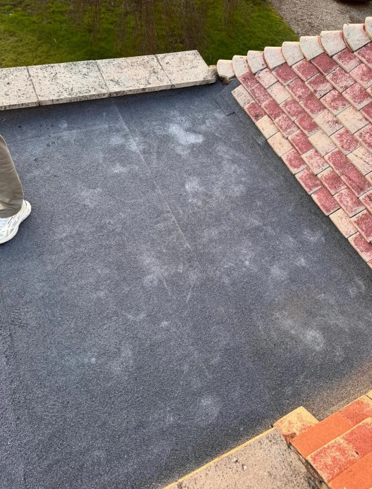 Mineral cap sheet flat roofing installation adjoining pitched roof tiles