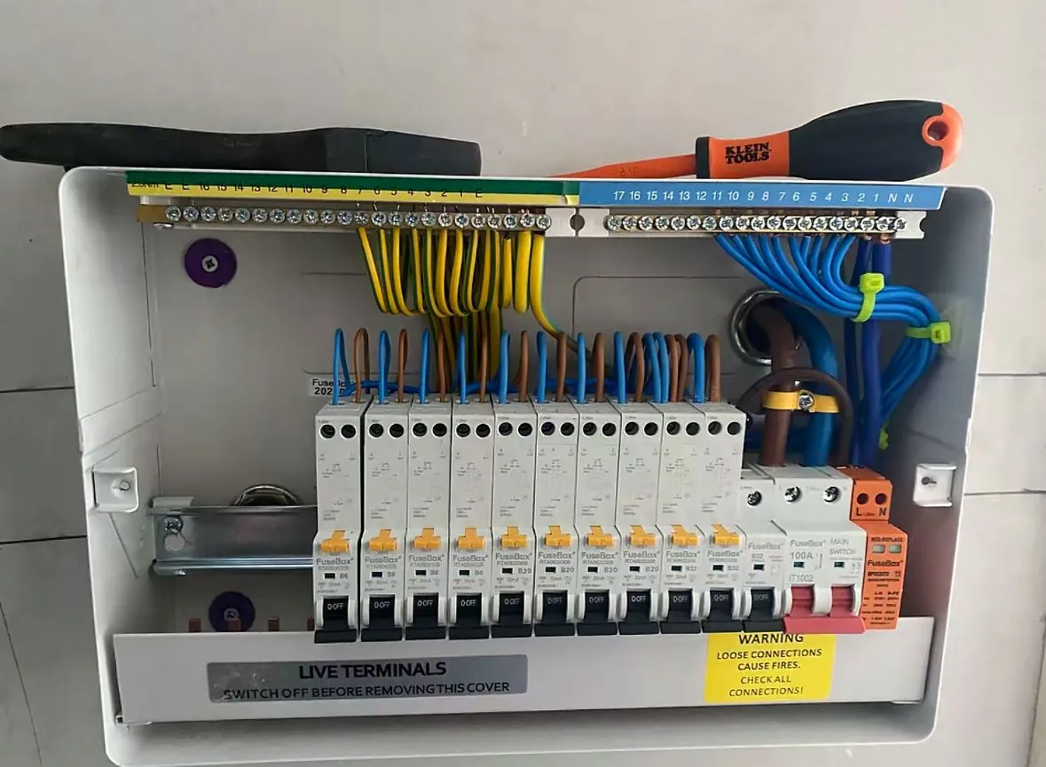 Modern metal-clad RCBO consumer unit with surge protection installation by Sussex Brown Sparks