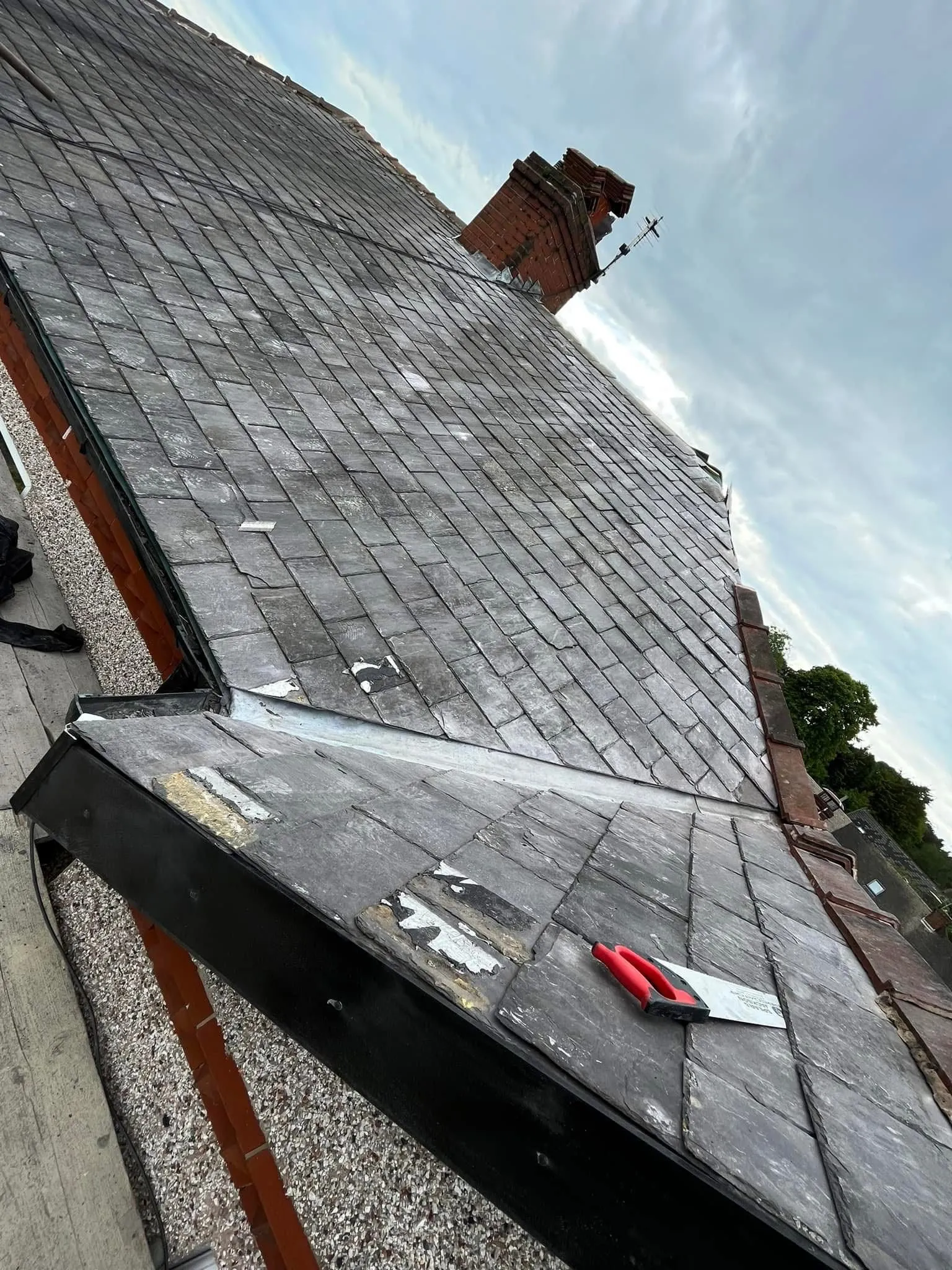 Professional slate roof repair and lead valley installation by Lancashire Roofing Specialist.