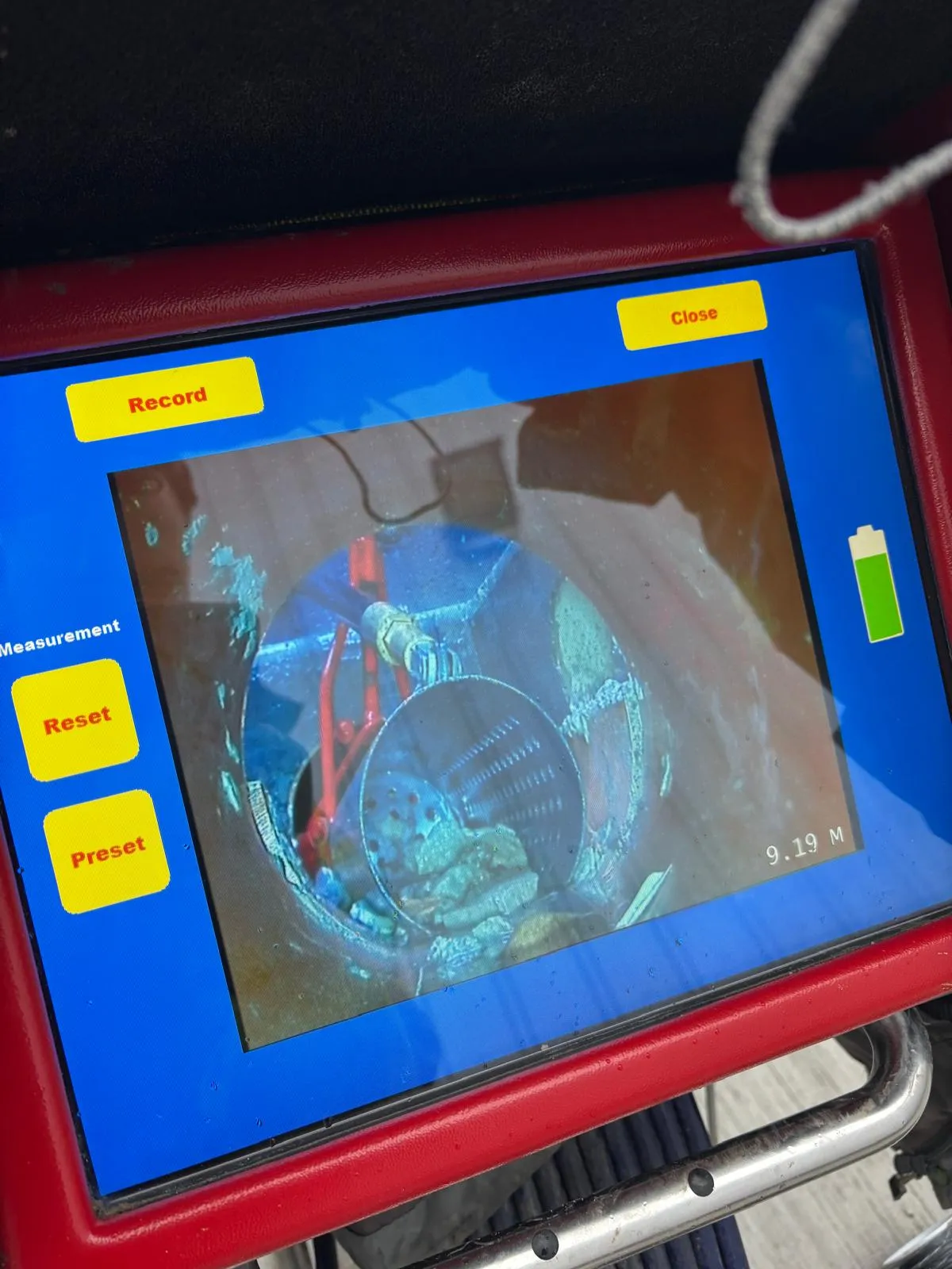 A drain inspection camera screen showing debris inside a pipe during a CCTV drain survey in Leeds.