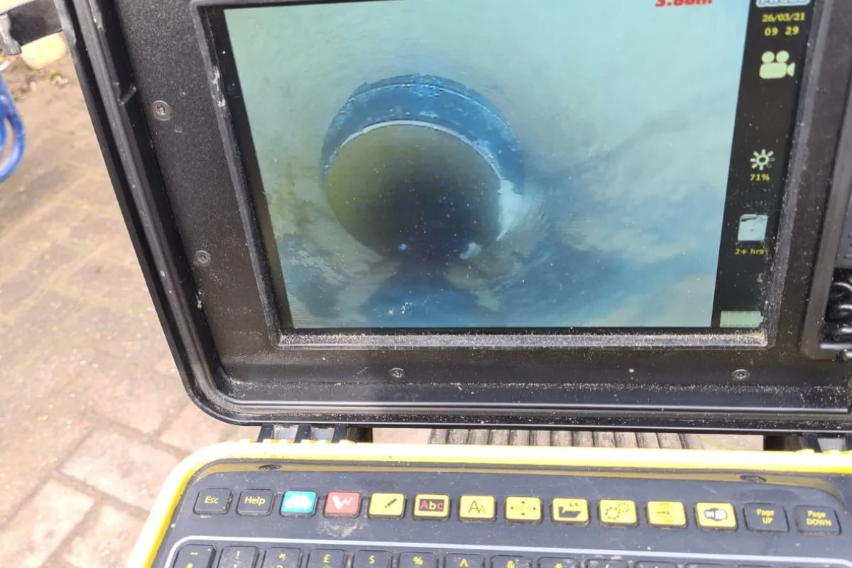 CCTV drain survey camera monitor showing the inside of a pipe during an inspection.