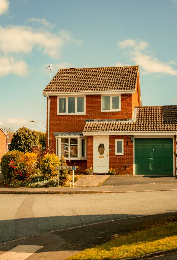 A detached red-brick domestic property in Yorkshire, representing typical existing dwellings requiring EPCs and PAS 2035 retrofit assessments