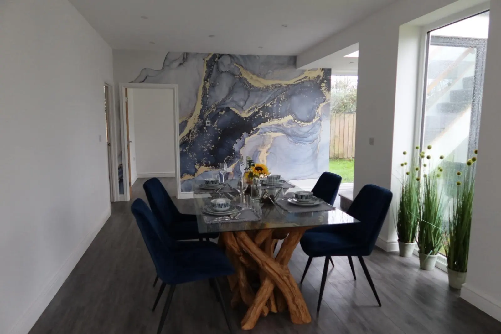 Freshly plastered and skimmed white walls in a modern dining room completed by Global Plastering in South Wales