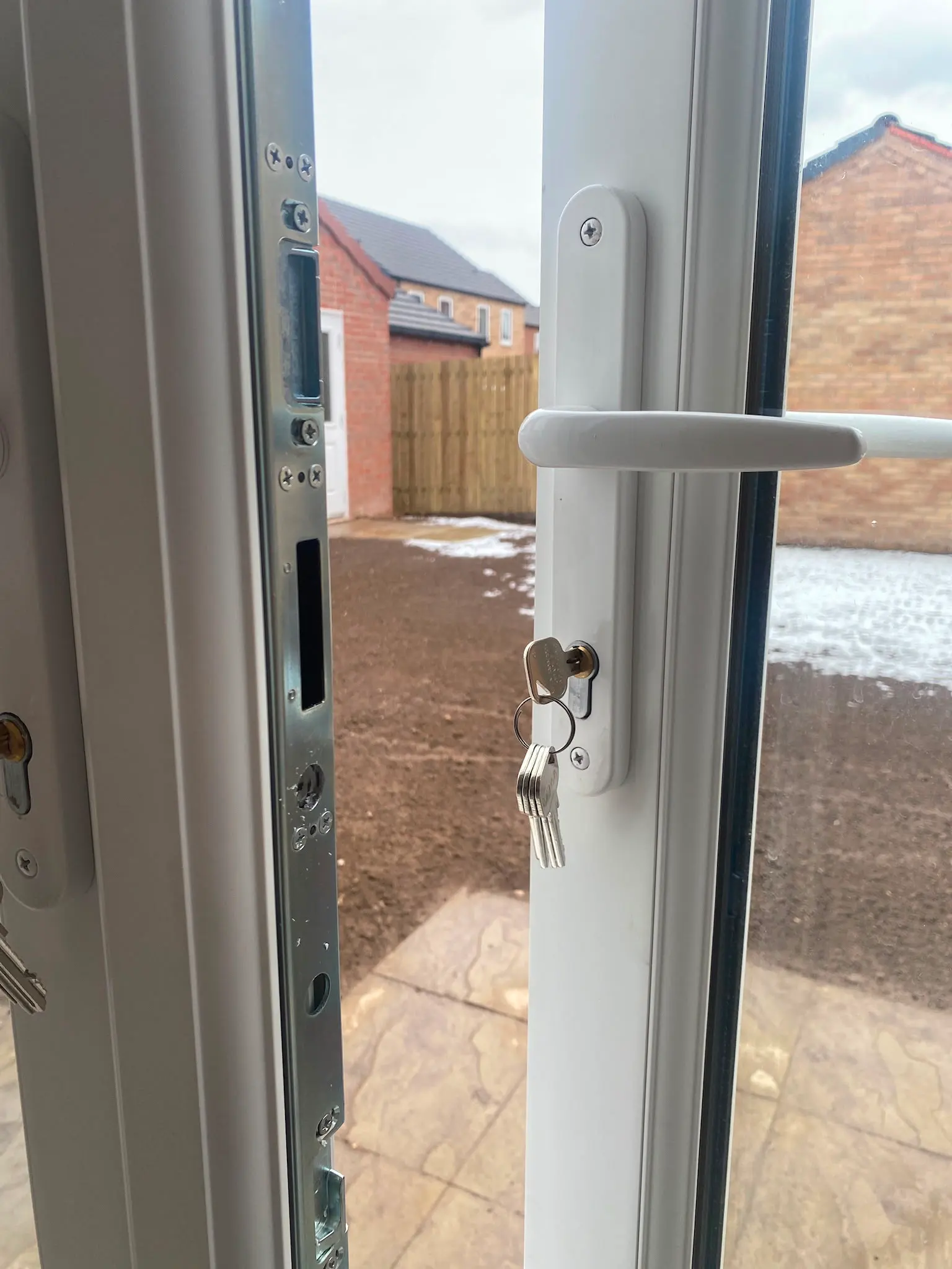 Open white uPVC door showing a multi-point lock mechanism and Euro cylinder lock, representing expert uPVC door lock repairs by Locksafe York Ltd