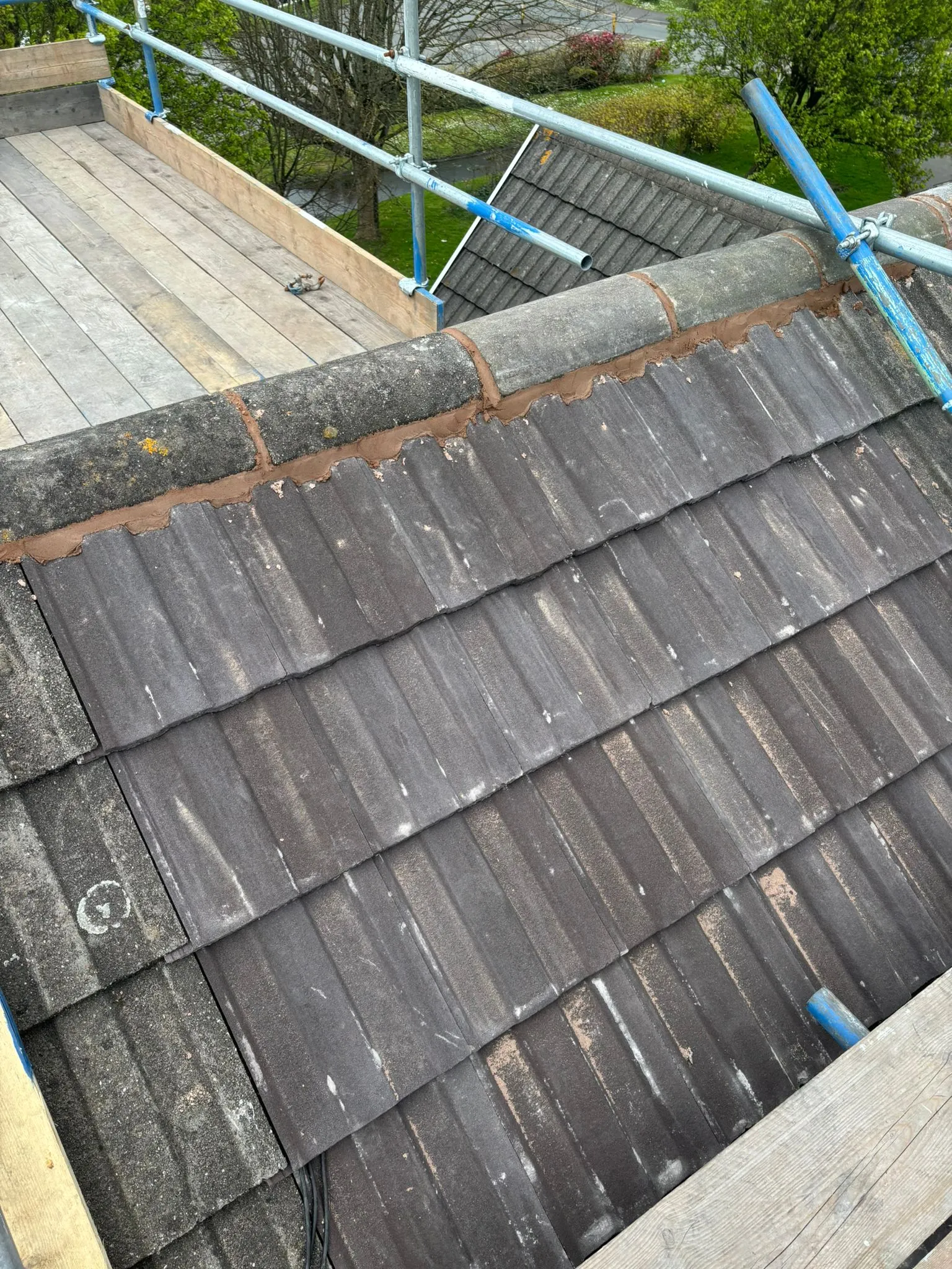Fresh mortar pointing on roof ridge tiles