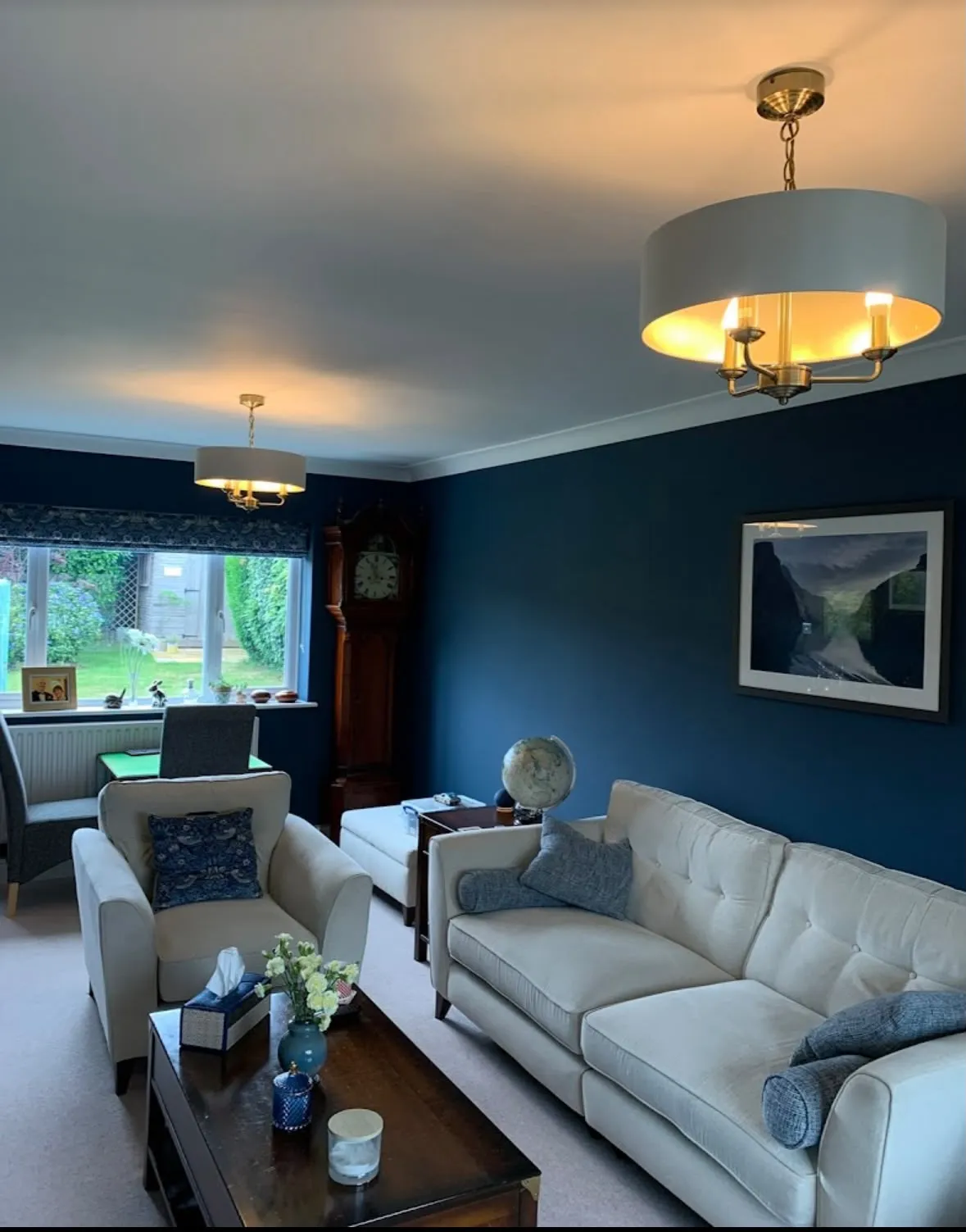 Feature lighting installation with matching pendant drum ceiling lights in a living room